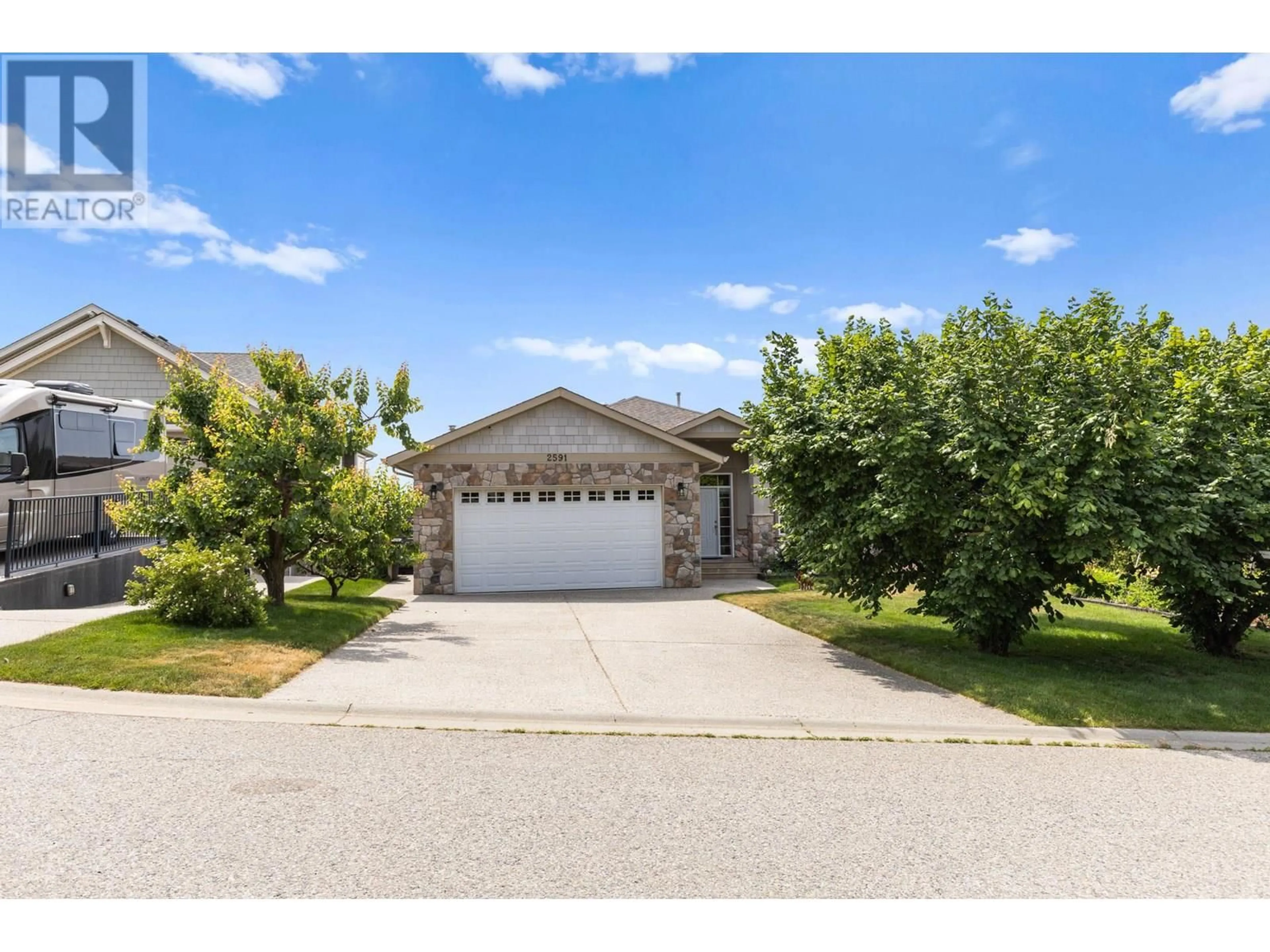 A pic from outside/outdoor area/front of a property/back of a property/a pic from drone, street for 2591 LAKE BREEZE COURT, Lake Country British Columbia V4V2M8