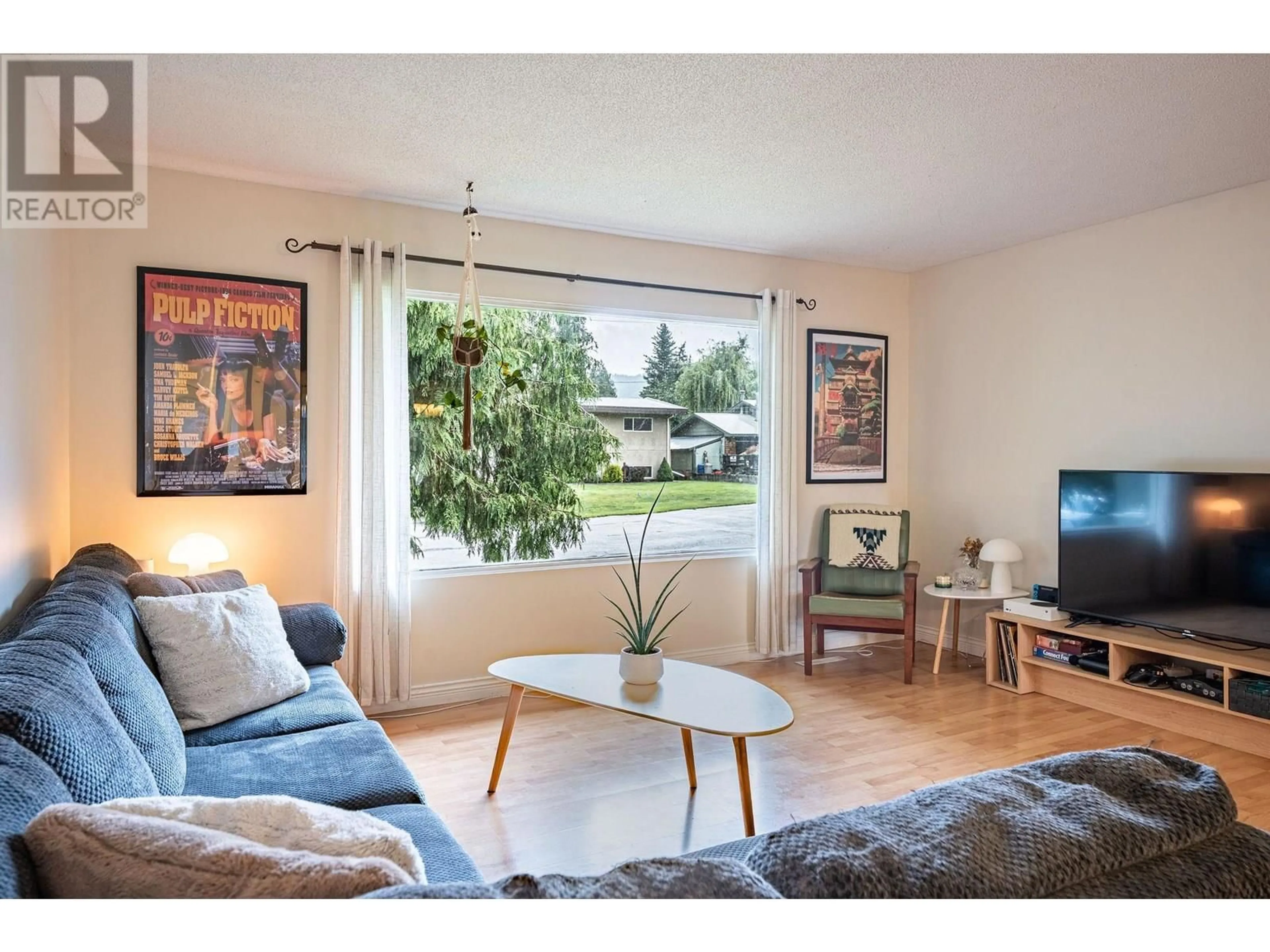 Living room with furniture, wood/laminate floor for 1981 MADDOCKS ROAD, Revelstoke British Columbia V0E2S0
