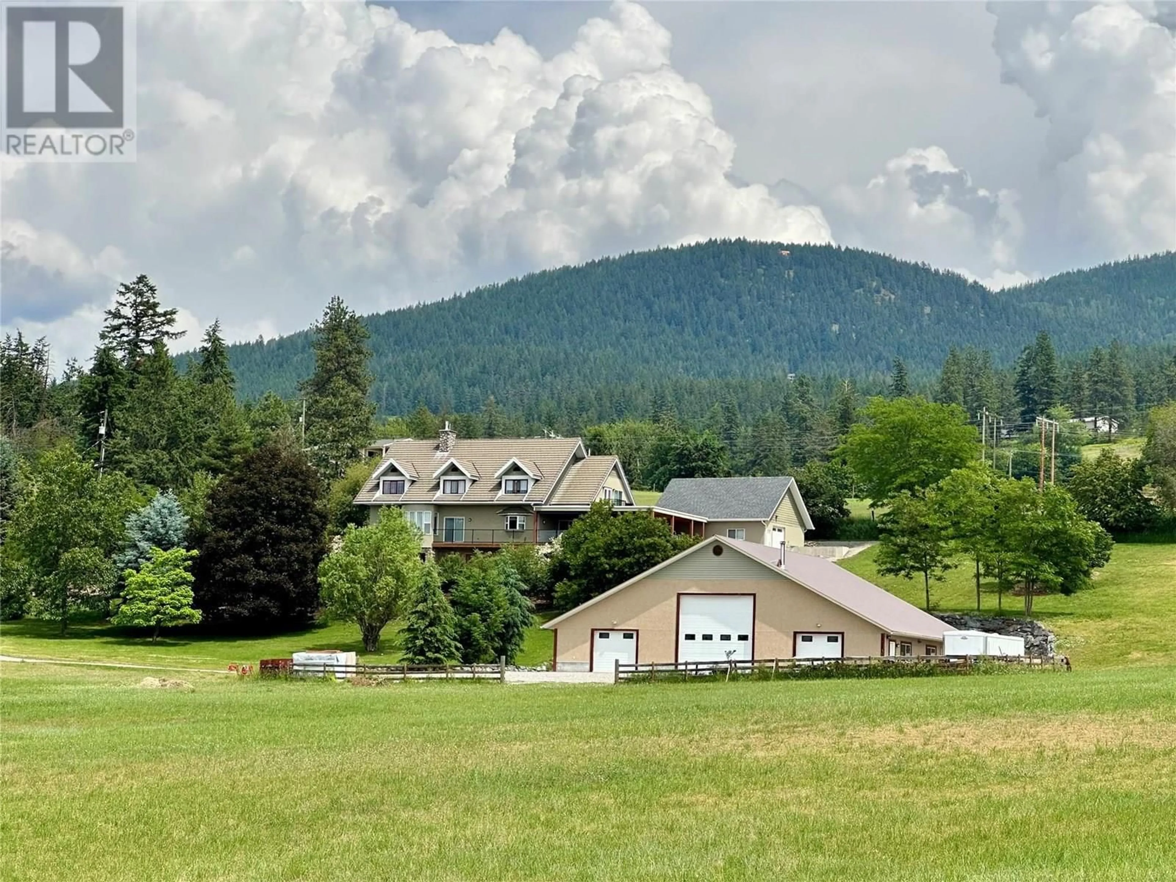 A pic from outside/outdoor area/front of a property/back of a property/a pic from drone, mountain view for 5393 EAST VERNON ROAD, Vernon British Columbia V1B3J7
