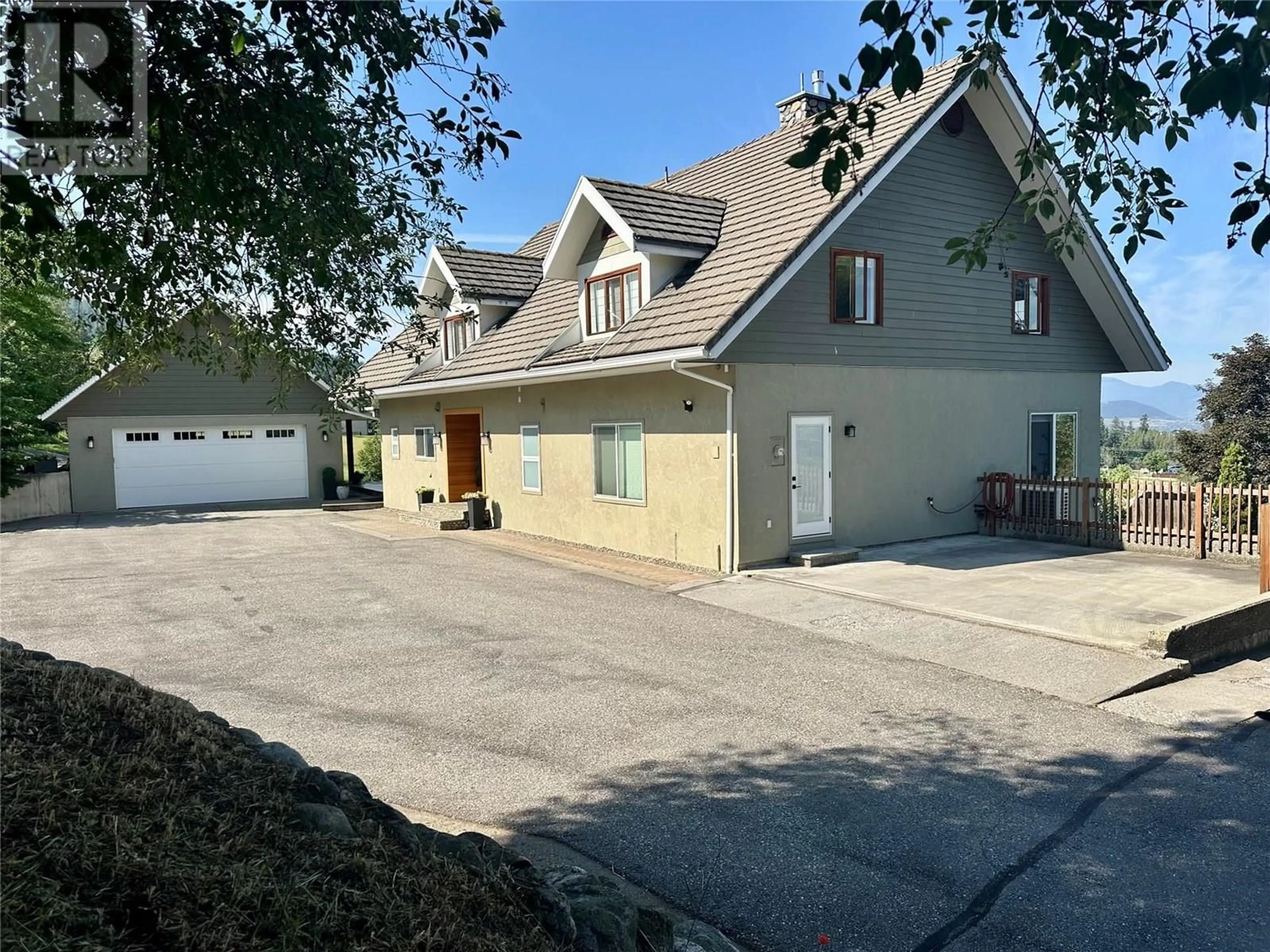 A pic from outside/outdoor area/front of a property/back of a property/a pic from drone, street for 5393 EAST VERNON ROAD, Vernon British Columbia V1B3J7