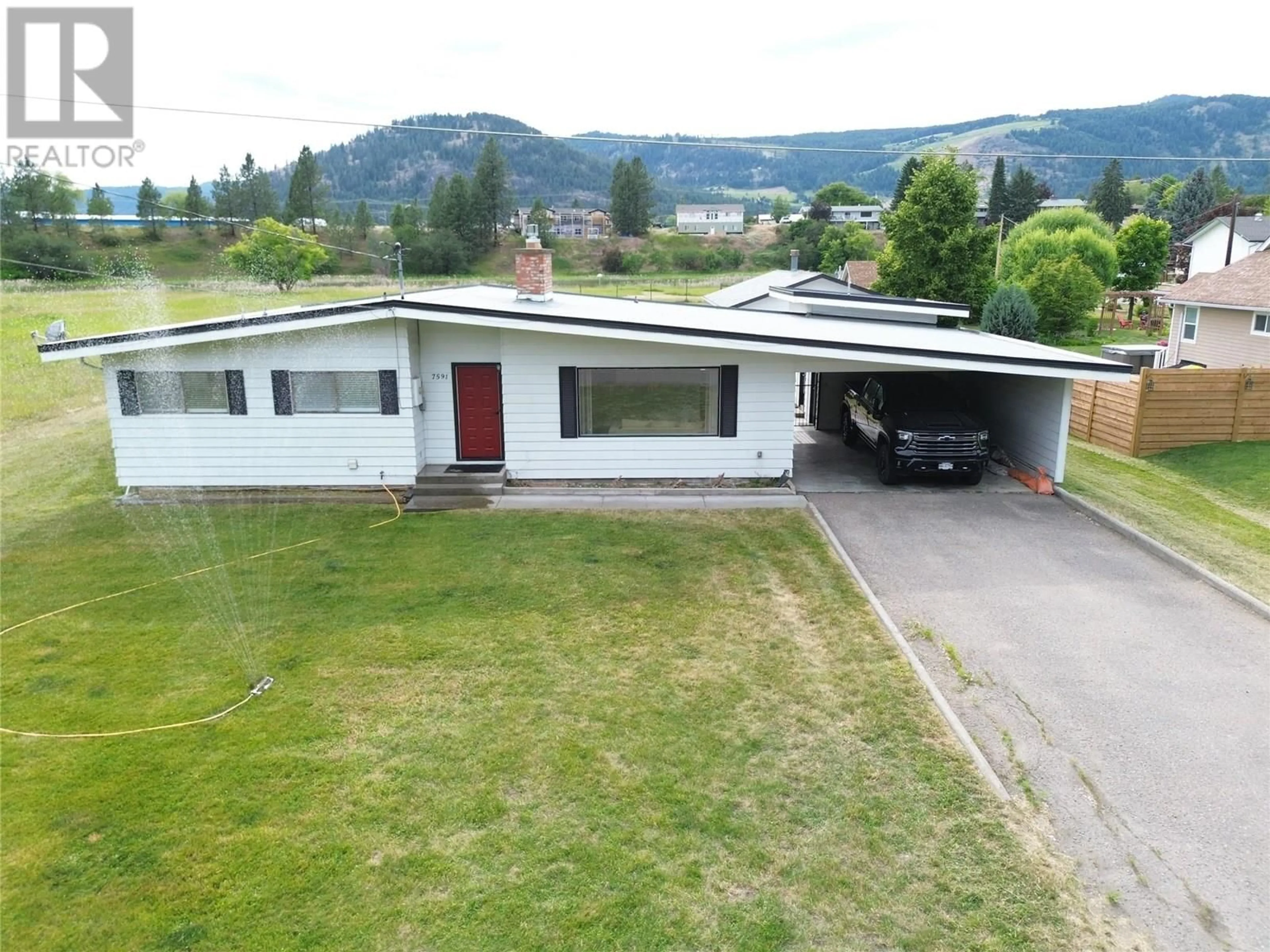 A pic from outside/outdoor area/front of a property/back of a property/a pic from drone, mountain view for 7591 17TH STREET, Grand Forks British Columbia V0H1H2