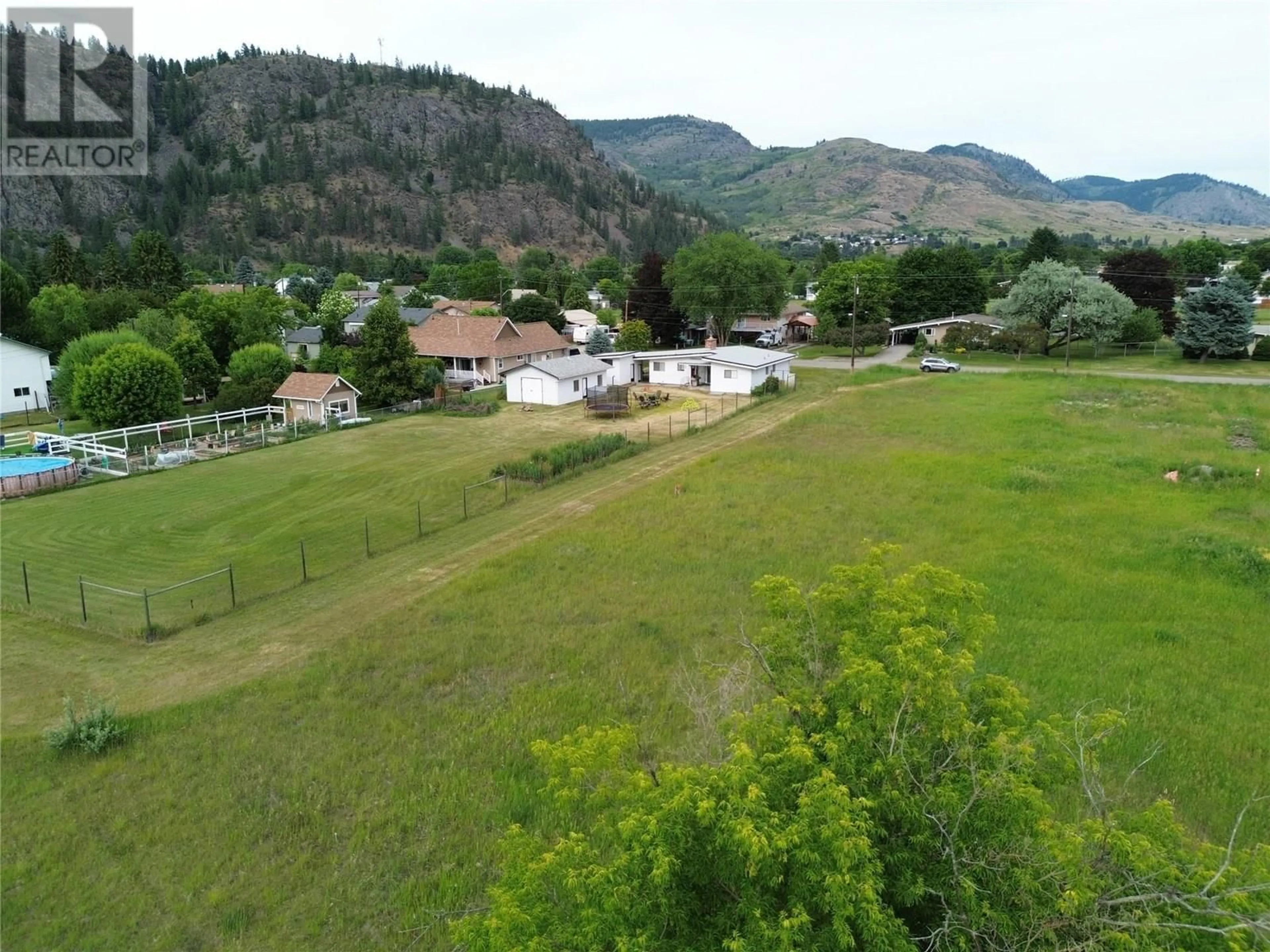 A pic from outside/outdoor area/front of a property/back of a property/a pic from drone, mountain view for 7591 17TH STREET, Grand Forks British Columbia V0H1H2