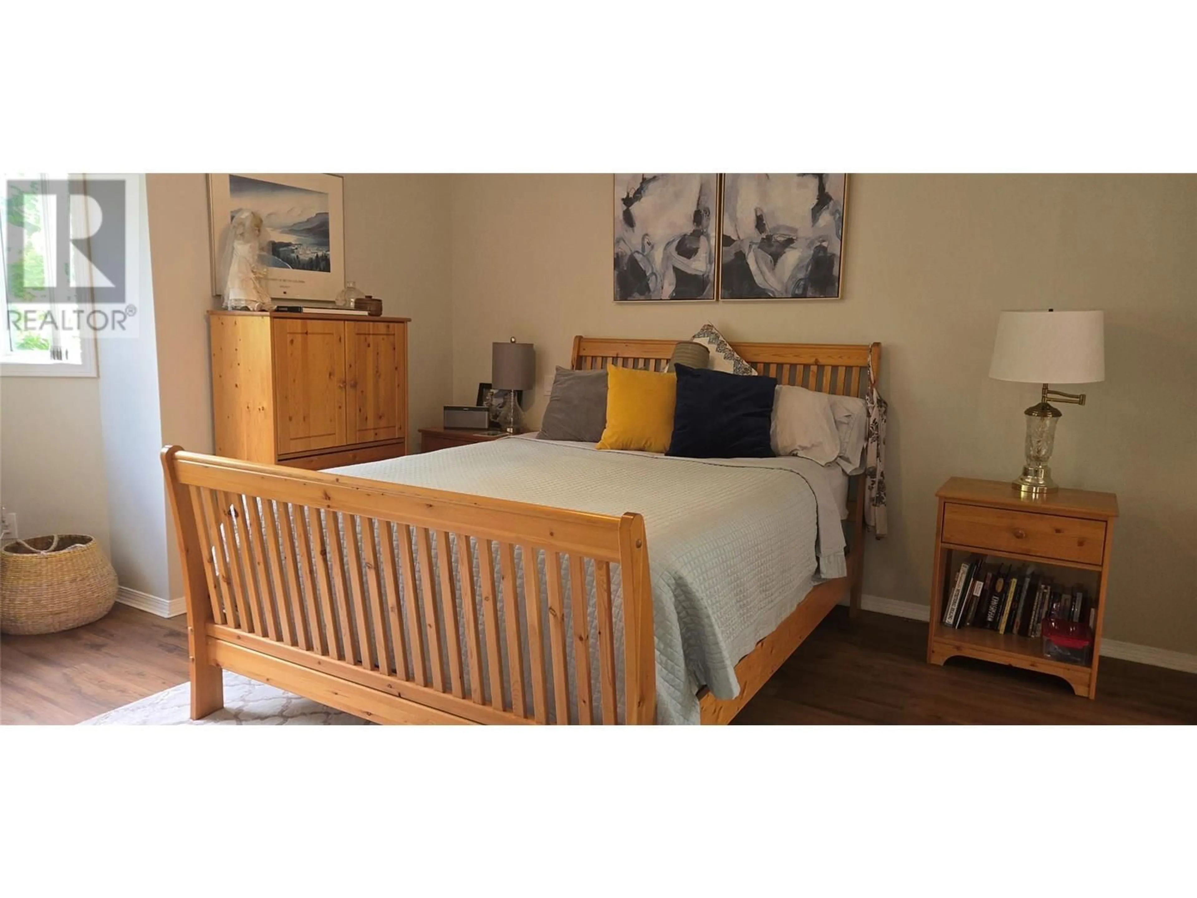 Bedroom with bed, wood/laminate floor for 104 - 8911 92ND AVENUE, Osoyoos British Columbia V0H1V2