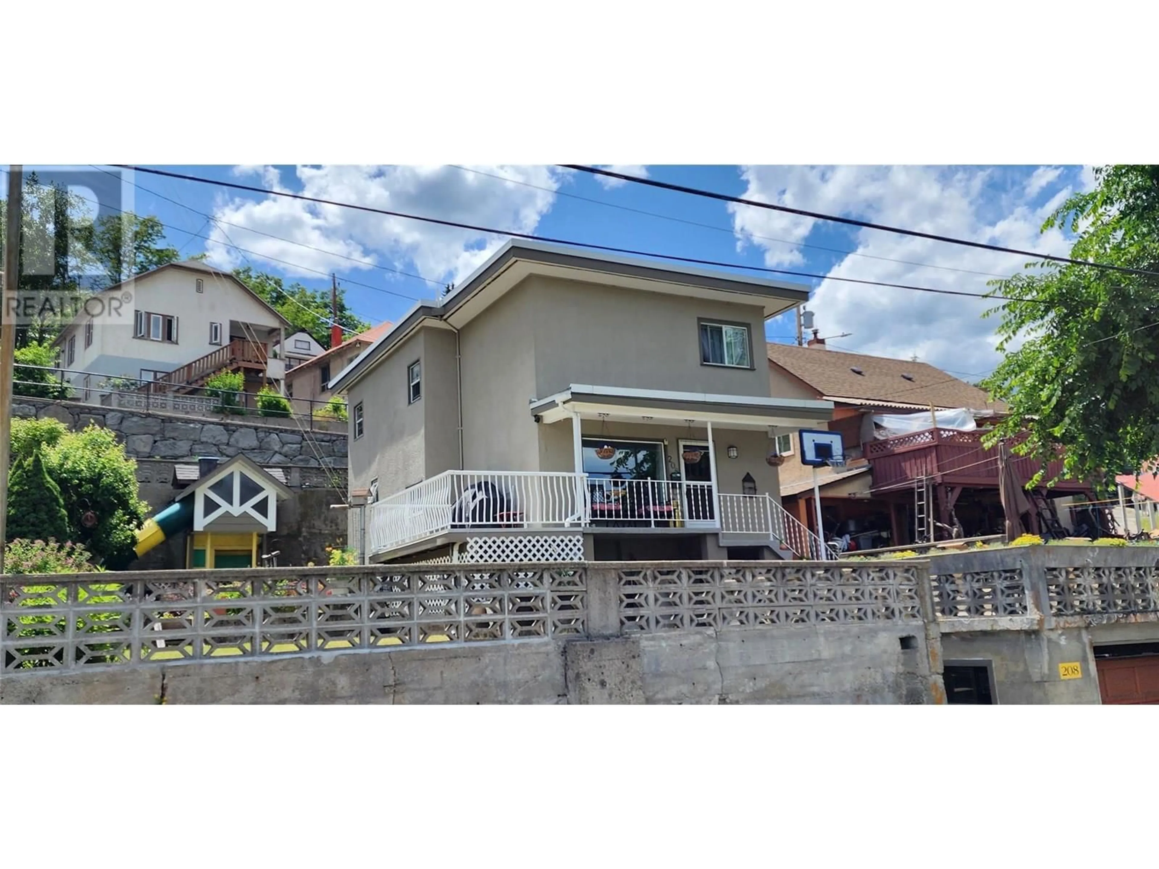 A pic from outside/outdoor area/front of a property/back of a property/a pic from drone, street for 208 LEROSE STREET, Trail British Columbia V1R3L8