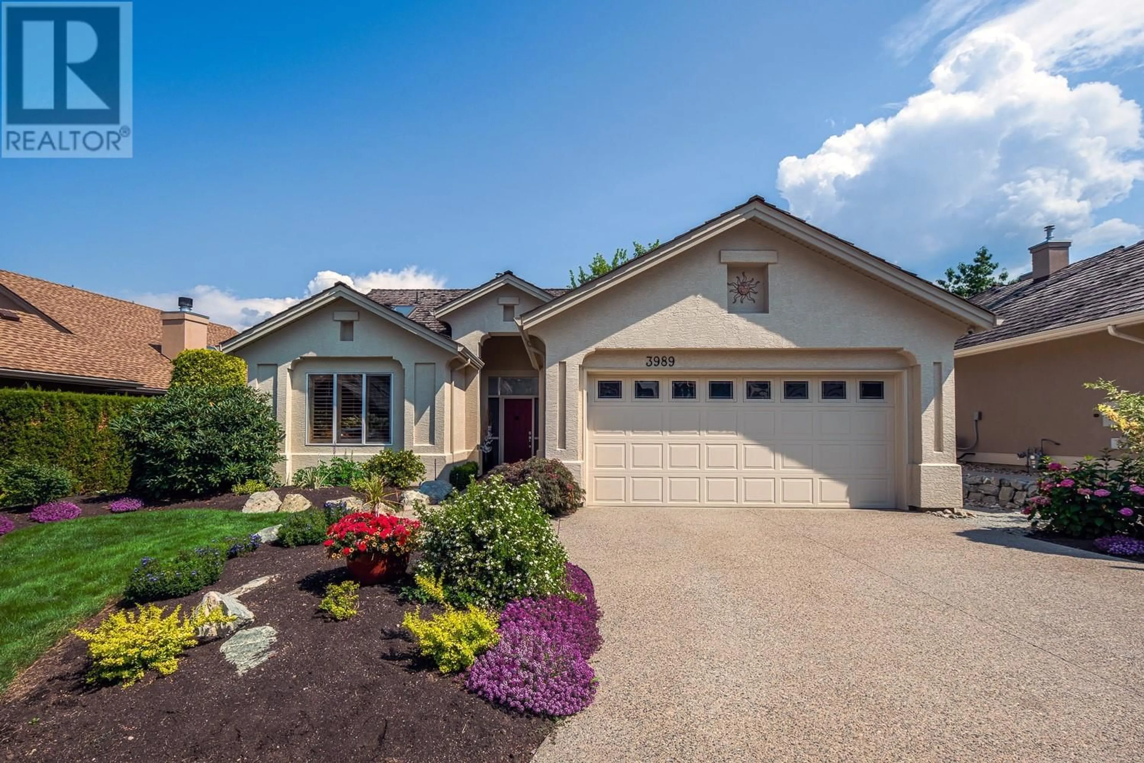 Home with vinyl exterior material, street for 3989 GALLAGHERS PARKLAND DRIVE, Kelowna British Columbia V1W3Z8
