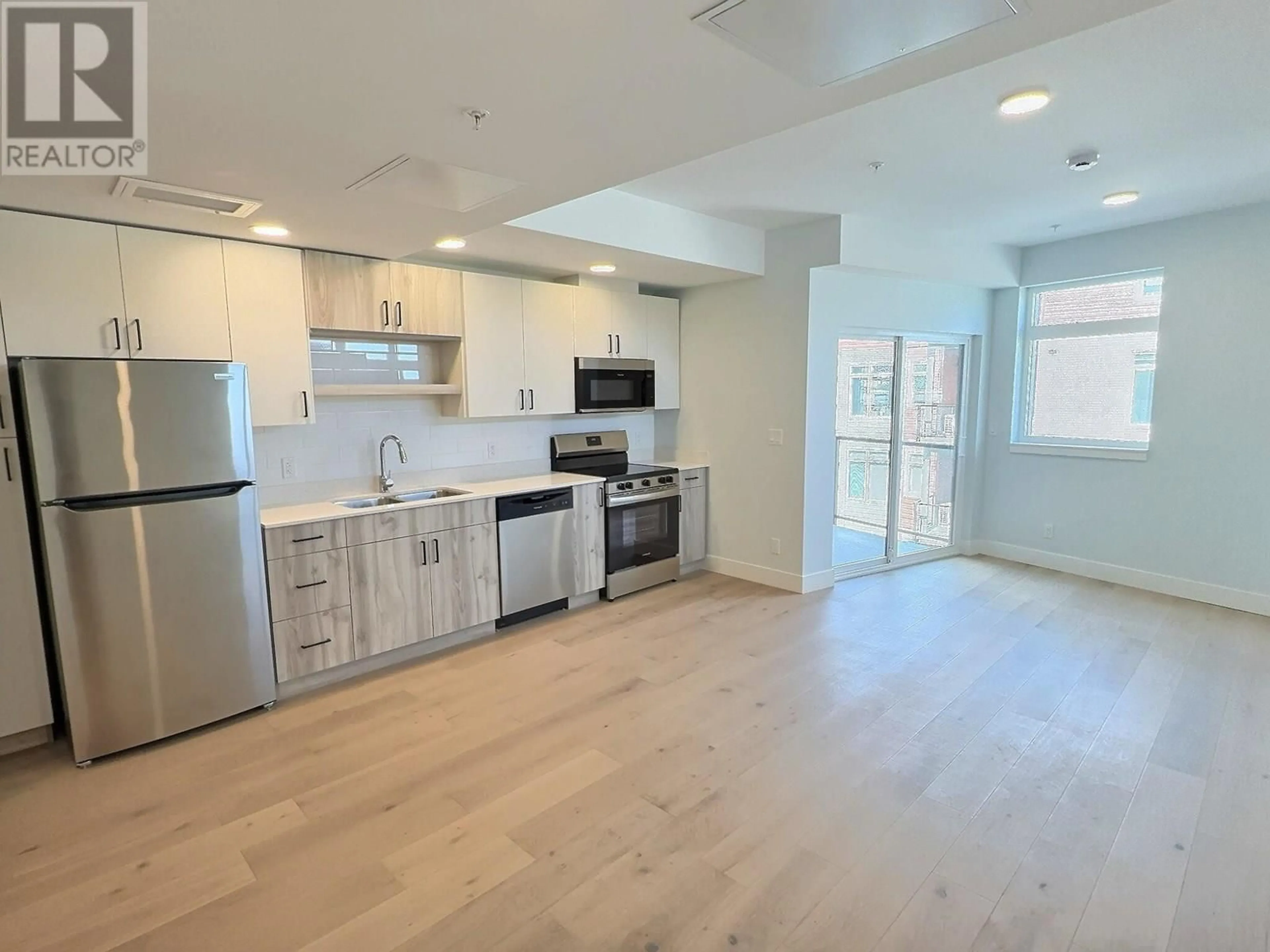 Open concept kitchen, wood/laminate floor for 308 - 207 ROYAL AVENUE, Kamloops British Columbia V2B8J7