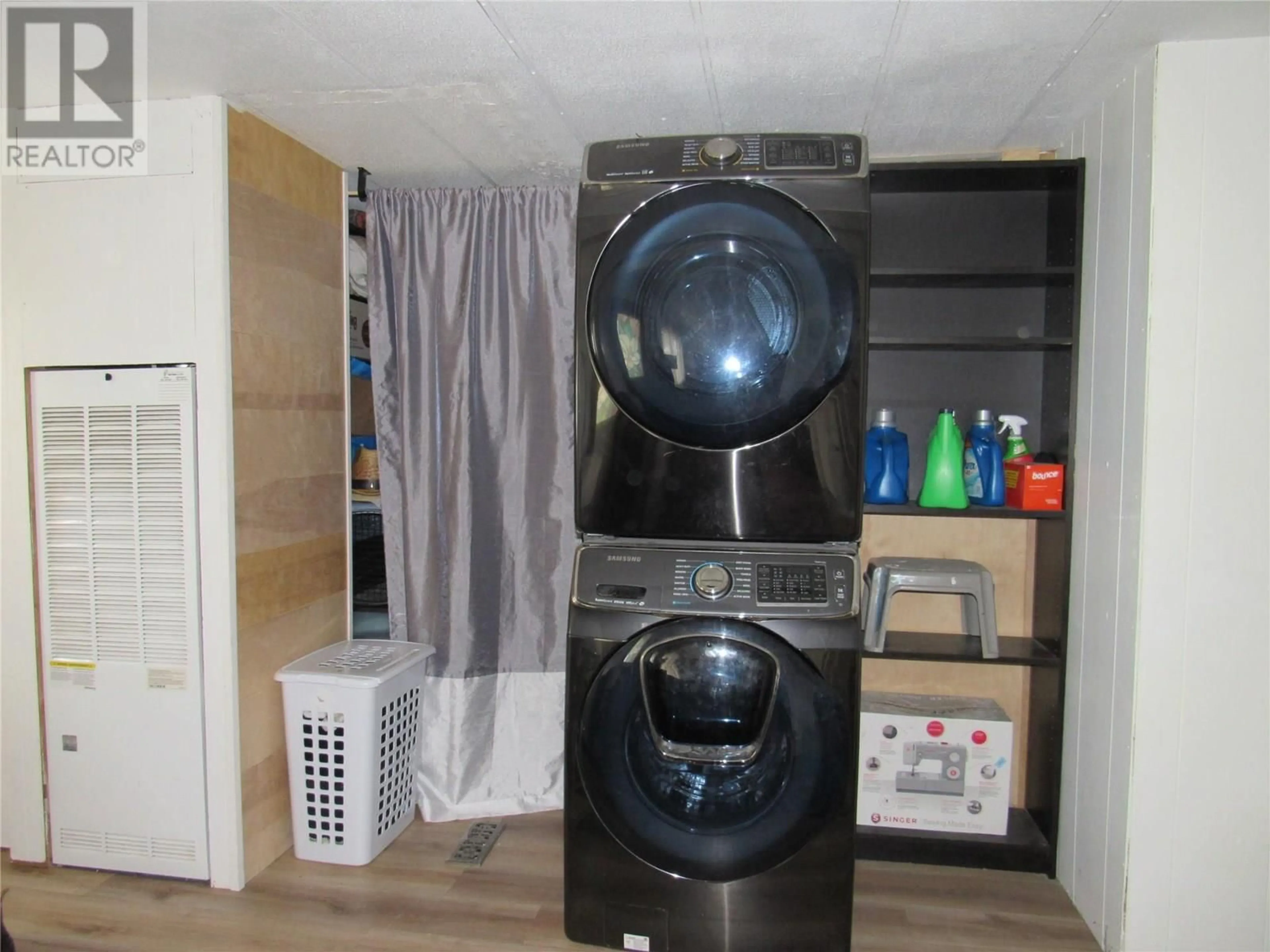 Kitchen with laundary machines, floor is not visible for 704 200TH AVENUE, Castlegar British Columbia V1N3P6