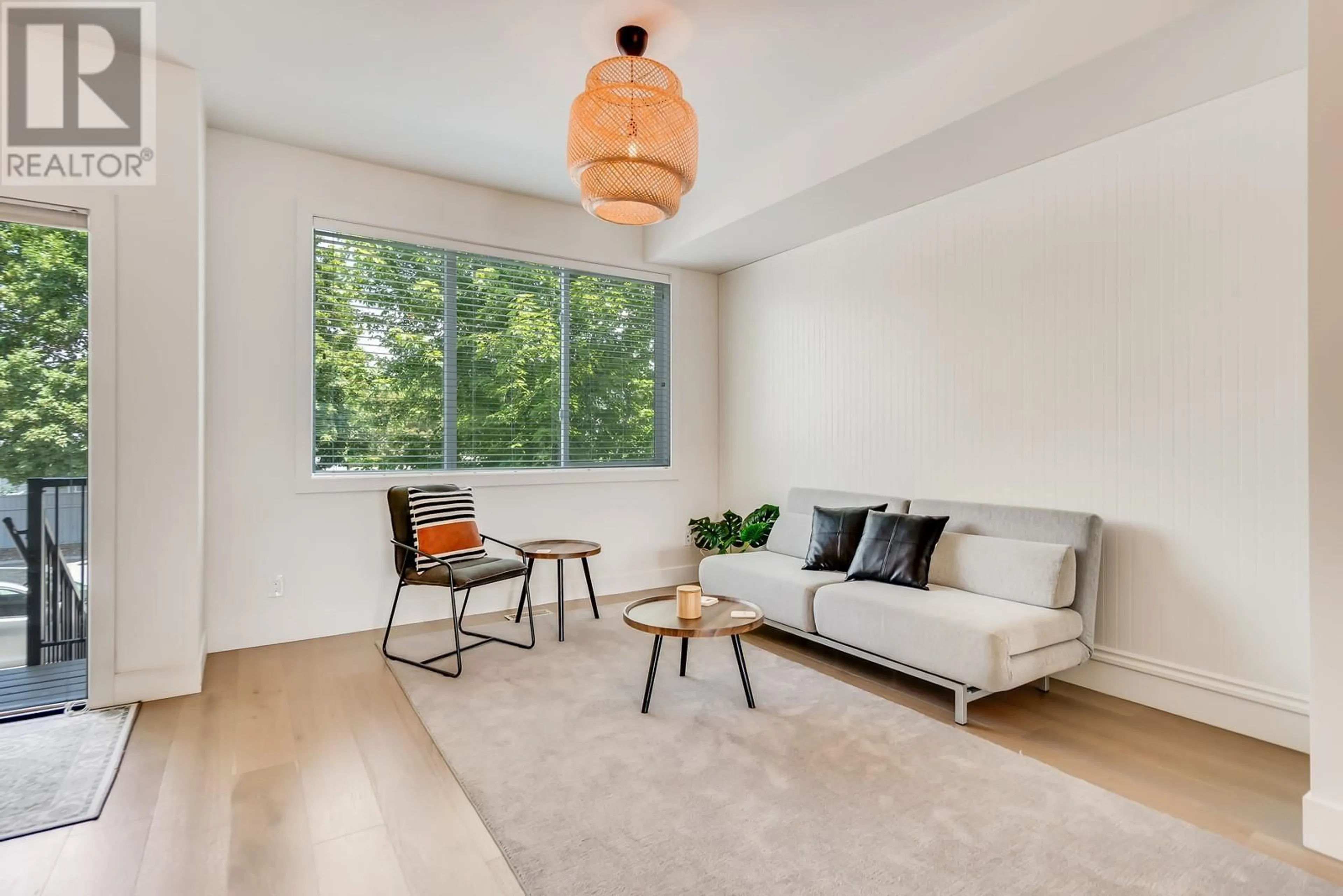 Living room with furniture, wood/laminate floor for 16 - 300 DRYSDALE BOULEVARD, Kelowna British Columbia V1V3E6