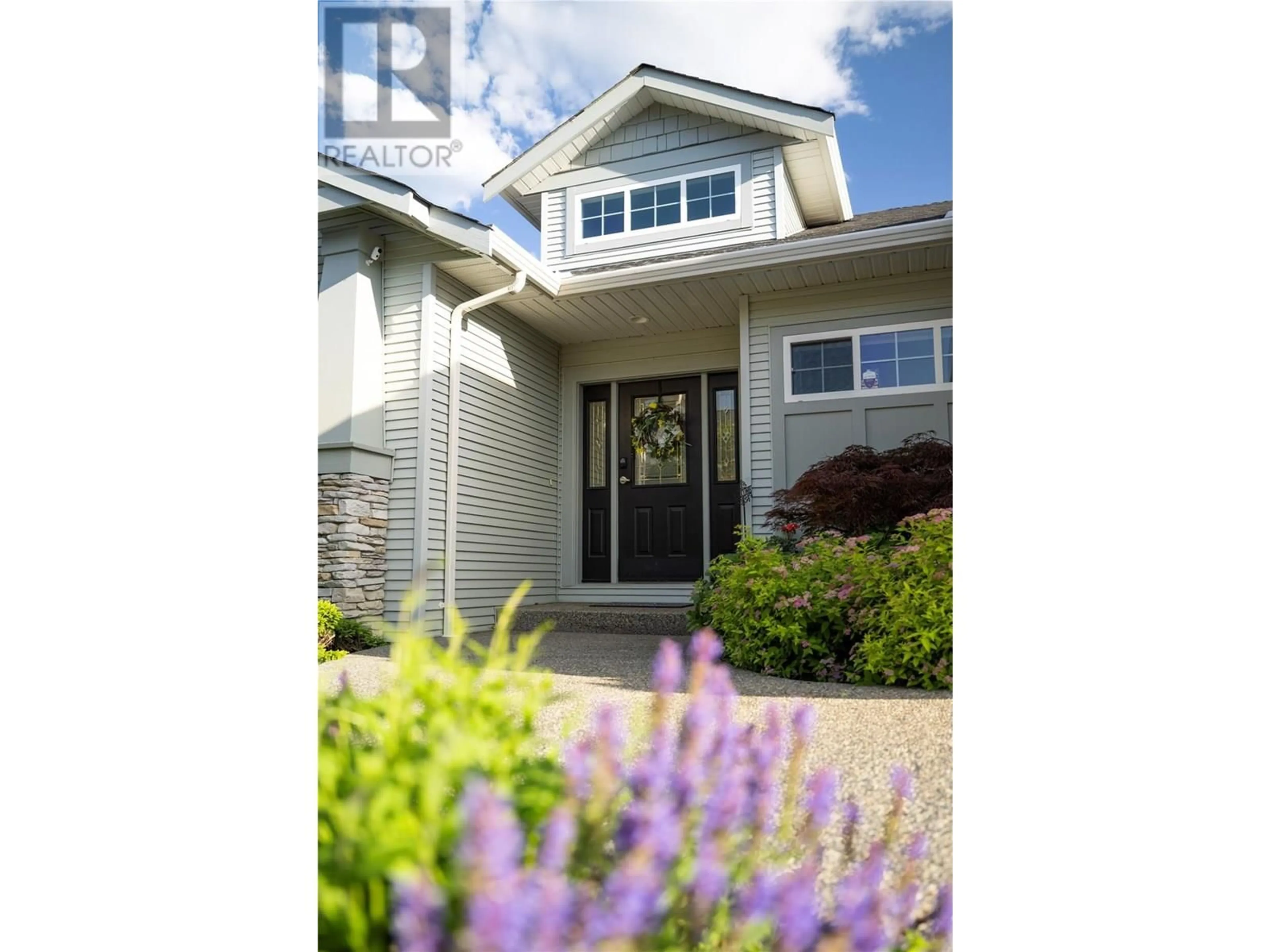 Home with vinyl exterior material, street for 8875 BRAEBURN DRIVE, Coldstream British Columbia V1B3W8