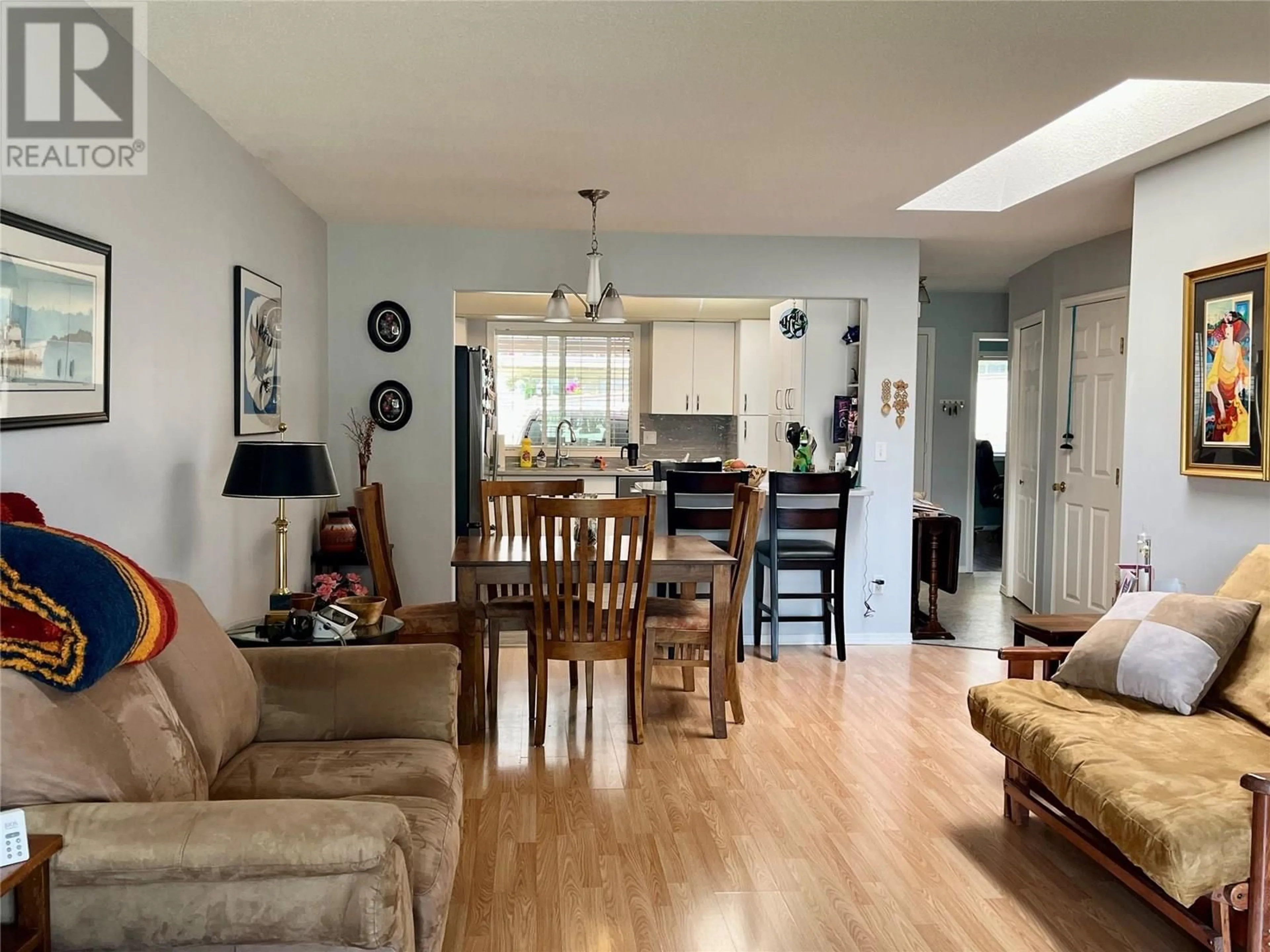 Living room with furniture, wood/laminate floor for 23 - 4210 ALEXIS PARK DRIVE, Vernon British Columbia V1T6H3