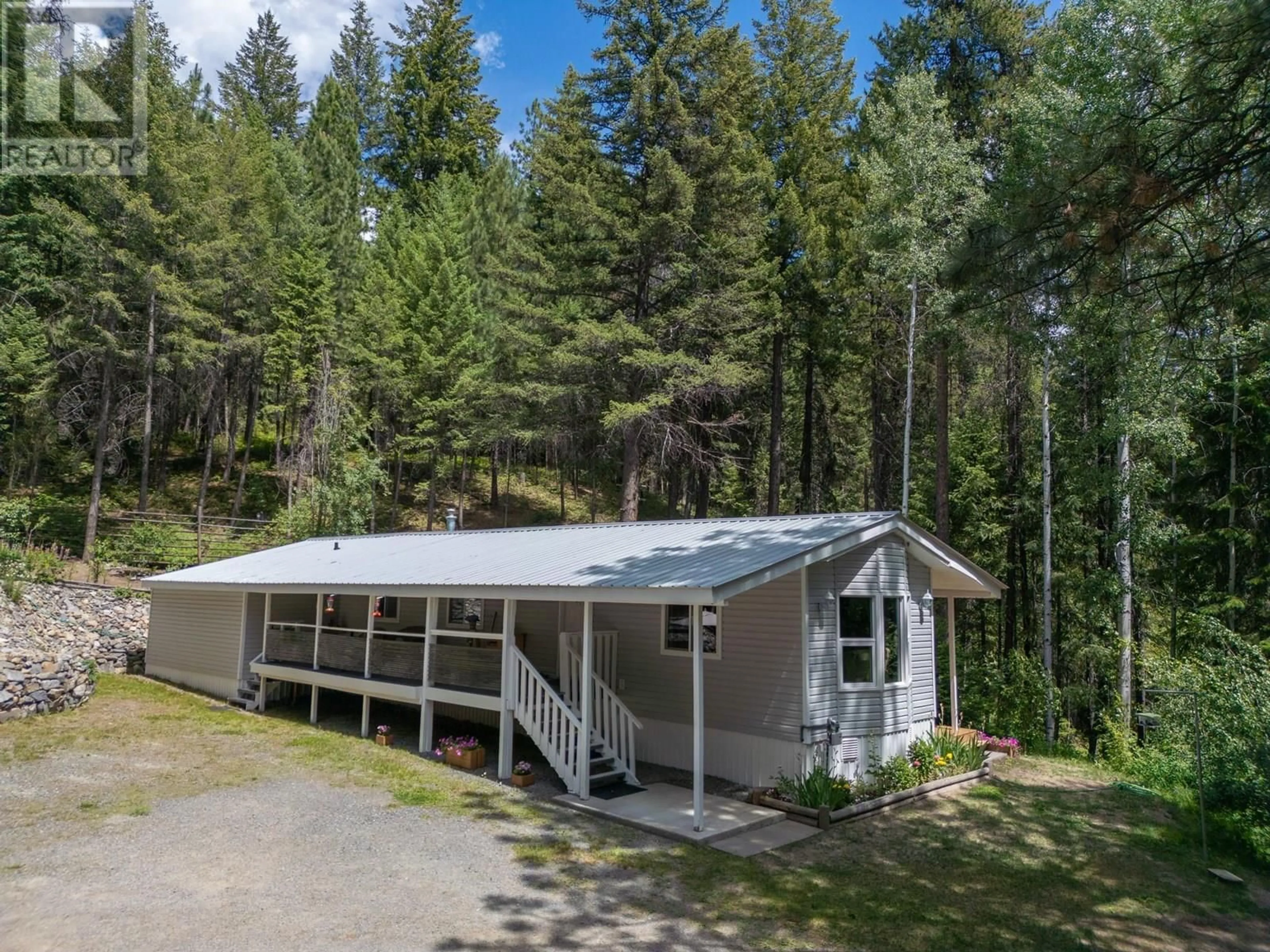 A pic from outside/outdoor area/front of a property/back of a property/a pic from drone, forest/trees view for 8682 YAHK SETTLEMENT ROAD, Yahk British Columbia V0B1W1