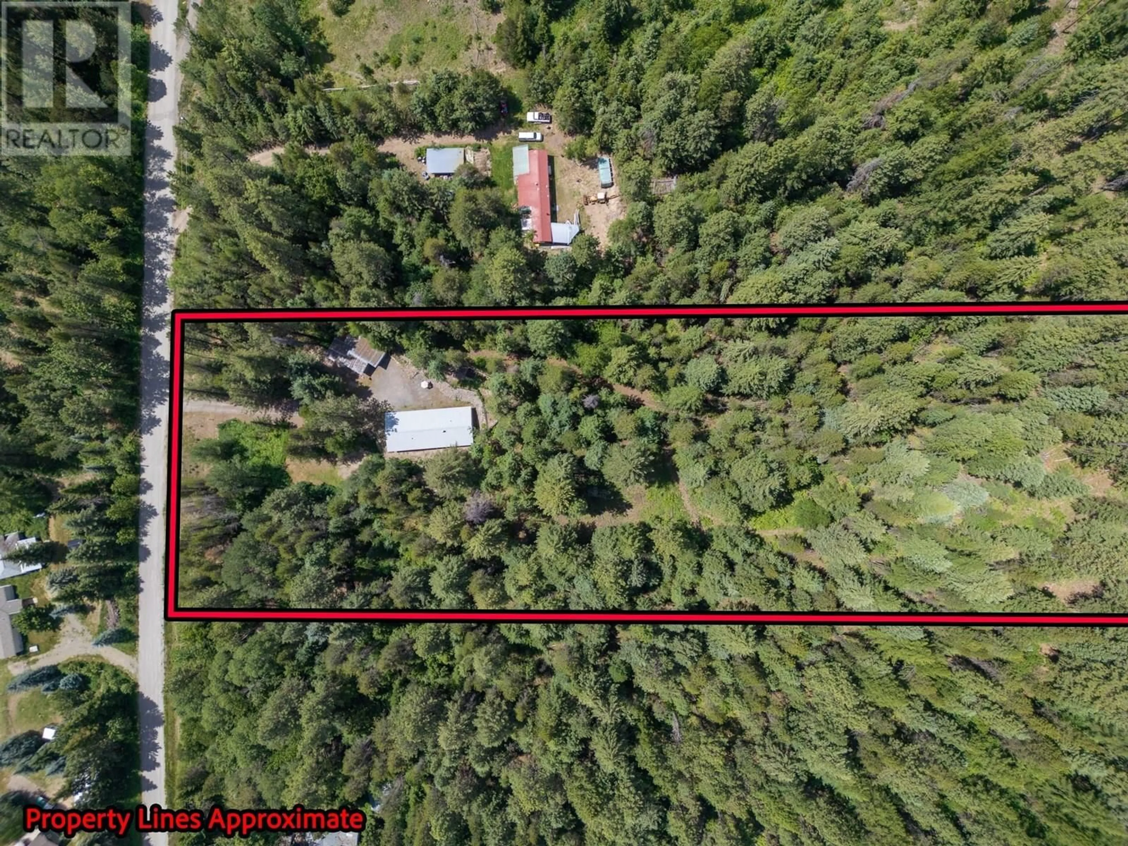 A pic from outside/outdoor area/front of a property/back of a property/a pic from drone, forest/trees view for 8682 YAHK SETTLEMENT ROAD, Yahk British Columbia V0B1W1
