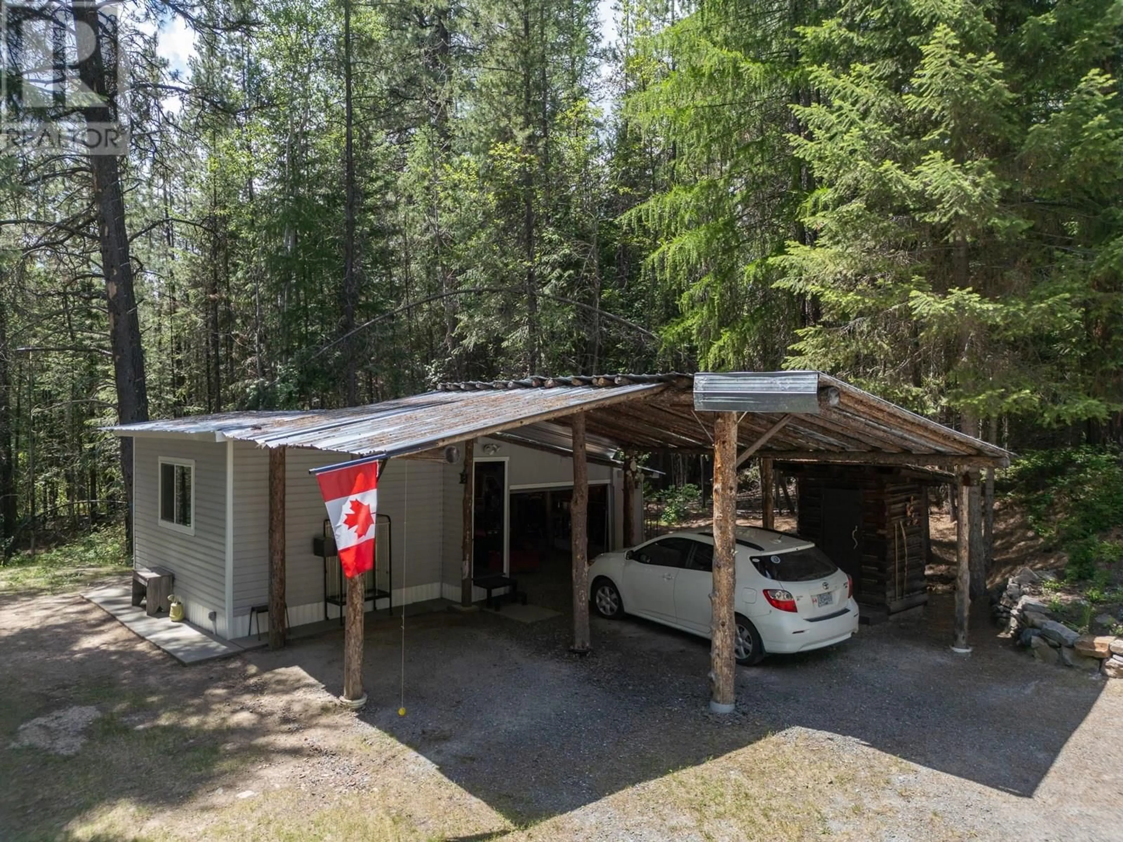 A pic from outside/outdoor area/front of a property/back of a property/a pic from drone, forest/trees view for 8682 YAHK SETTLEMENT ROAD, Yahk British Columbia V0B1W1