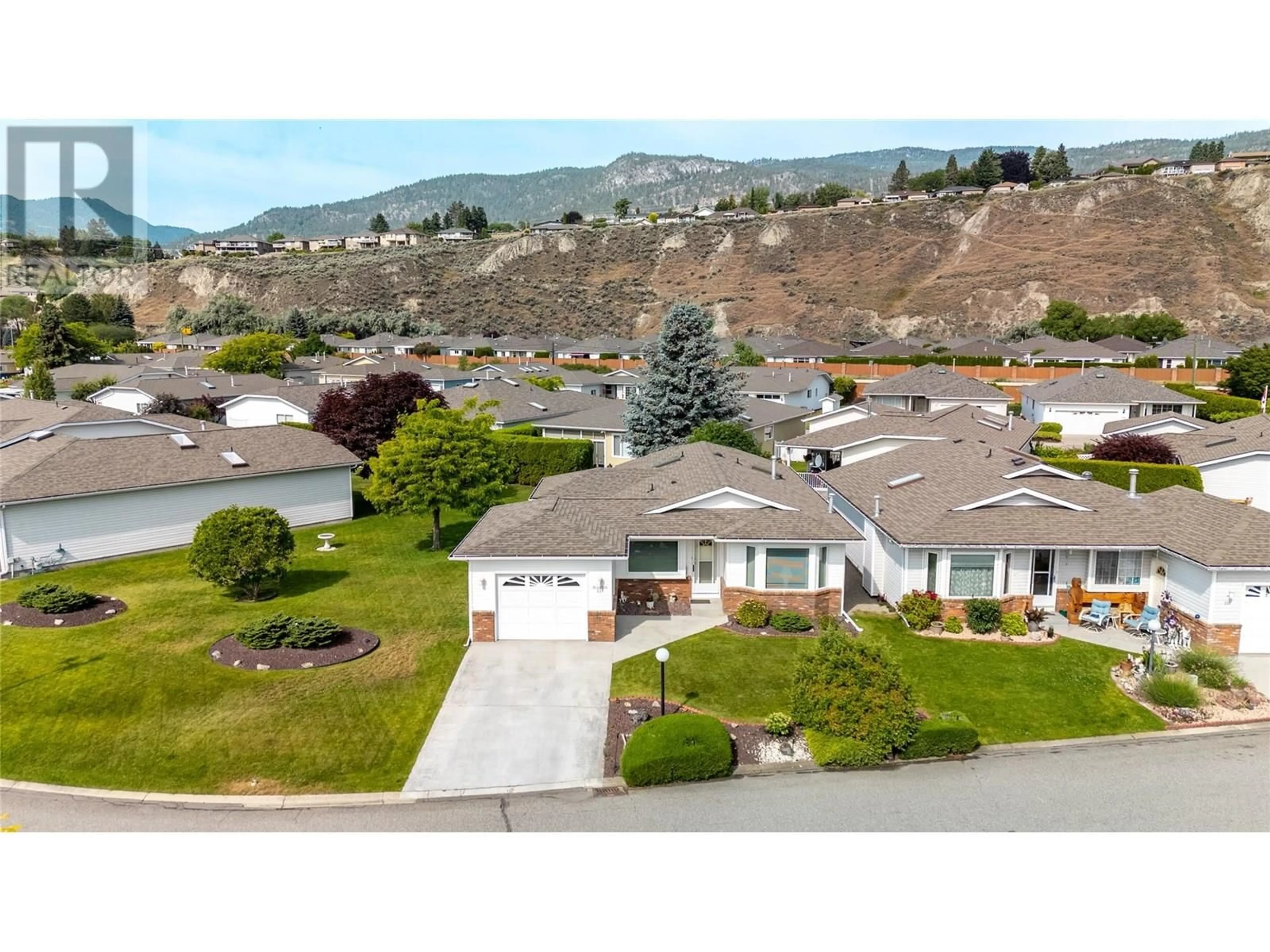 A pic from outside/outdoor area/front of a property/back of a property/a pic from drone, mountain view for 220 SANDPIPER CRESCENT, Penticton British Columbia V2A8K6