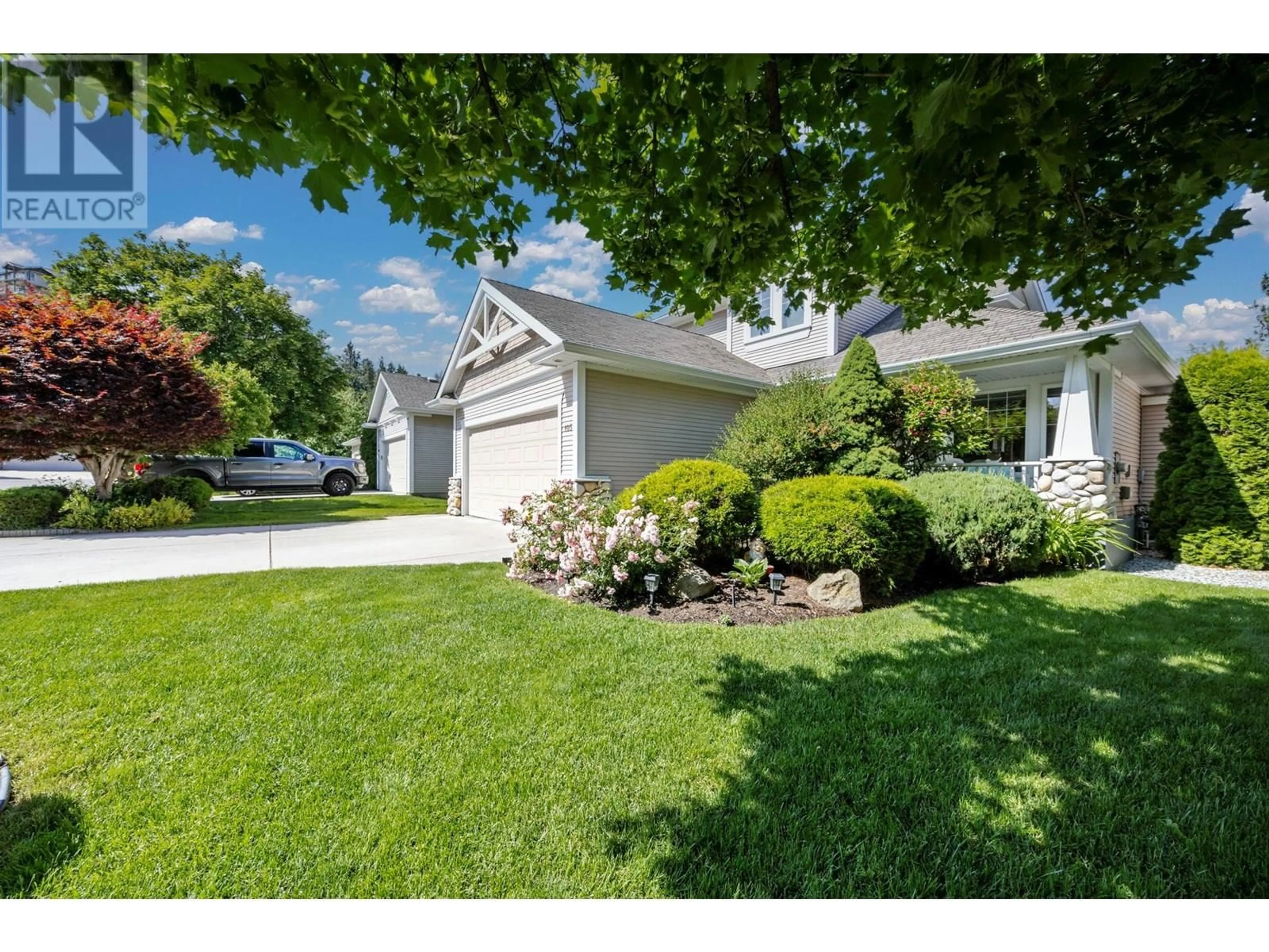 A pic from outside/outdoor area/front of a property/back of a property/a pic from drone, street for 105 - 2220 SHANNON RIDGE DRIVE, West Kelowna British Columbia V4T2T6
