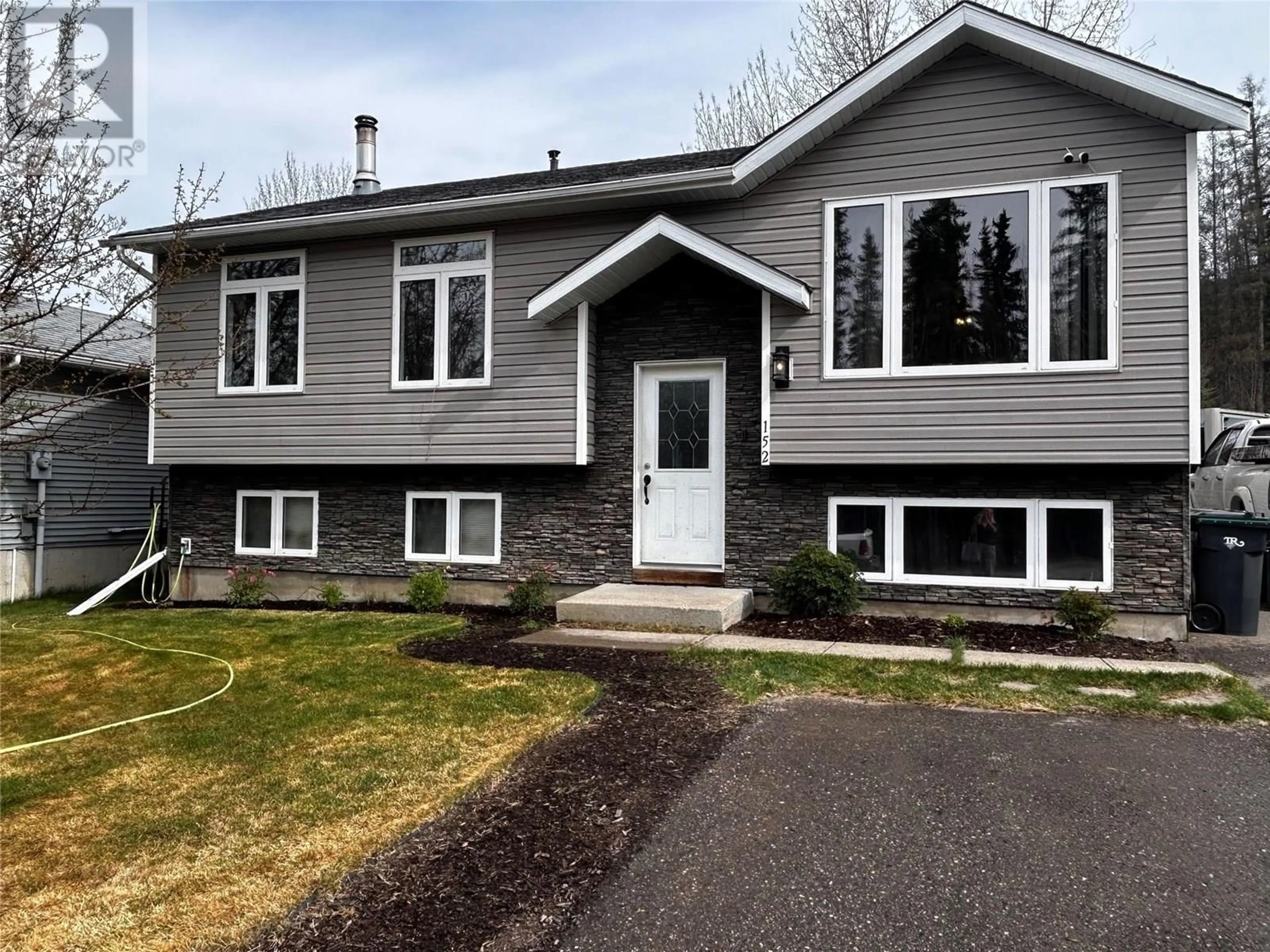 Home with vinyl exterior material, street for 152 WAPITI CRESCENT, Tumbler Ridge British Columbia V0C2W0