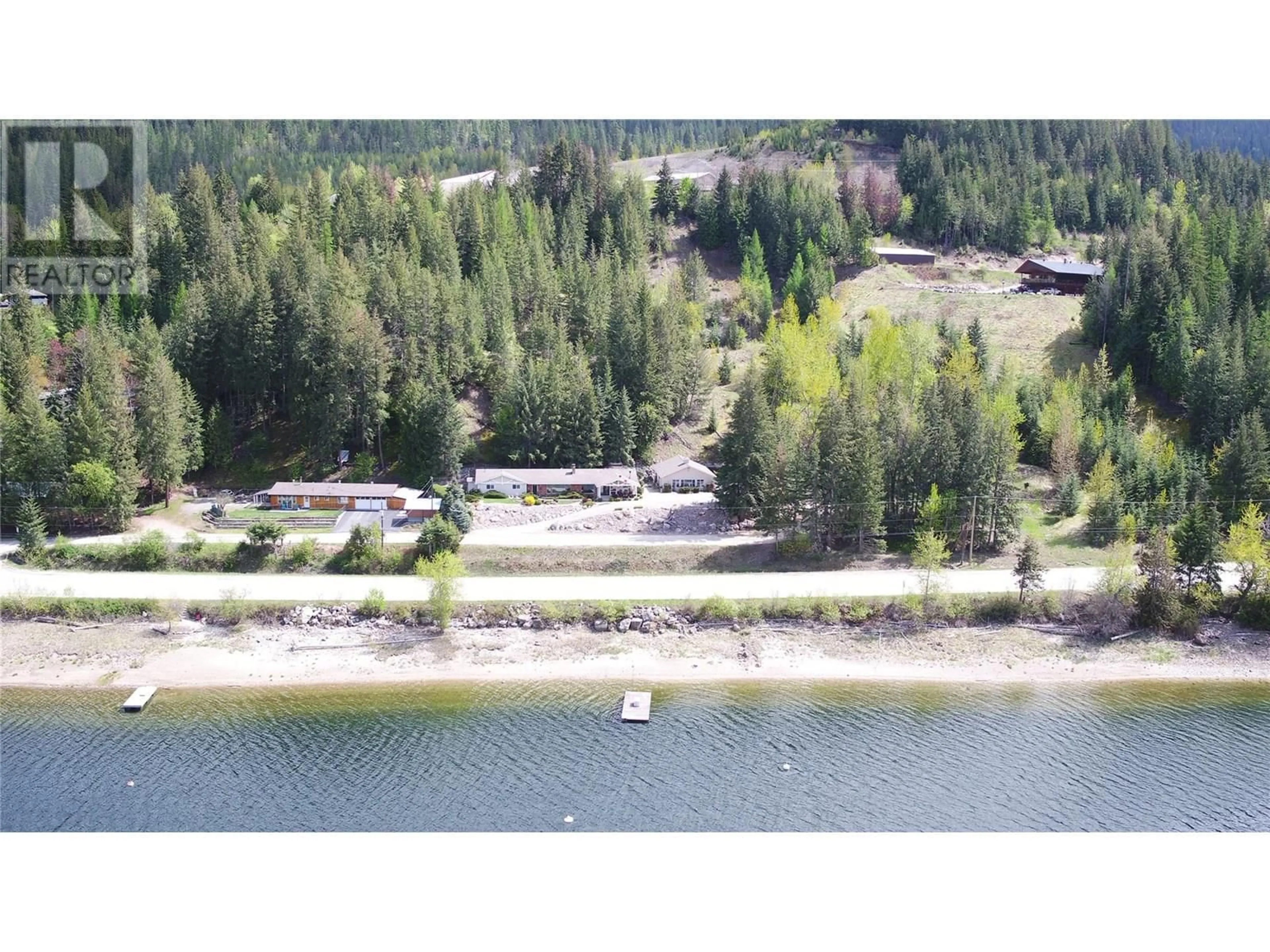 A pic from outside/outdoor area/front of a property/back of a property/a pic from drone, water/lake/river/ocean view for 9178 CLANCY FRONTAGE ROAD, Mara British Columbia V0E2K0