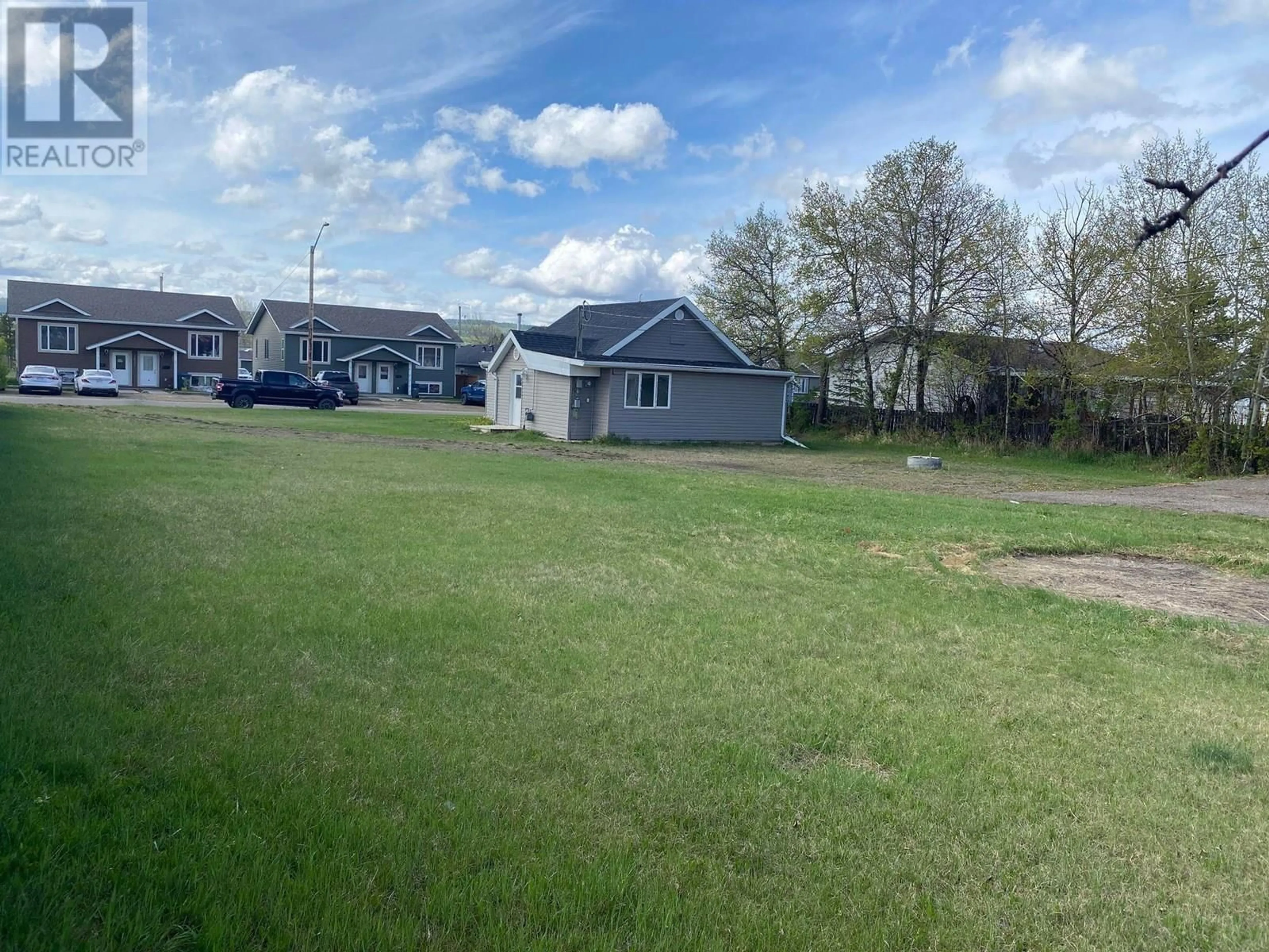 A pic from outside/outdoor area/front of a property/back of a property/a pic from drone, street for 1624 100 AVENUE, Dawson Creek British Columbia V1G1X2