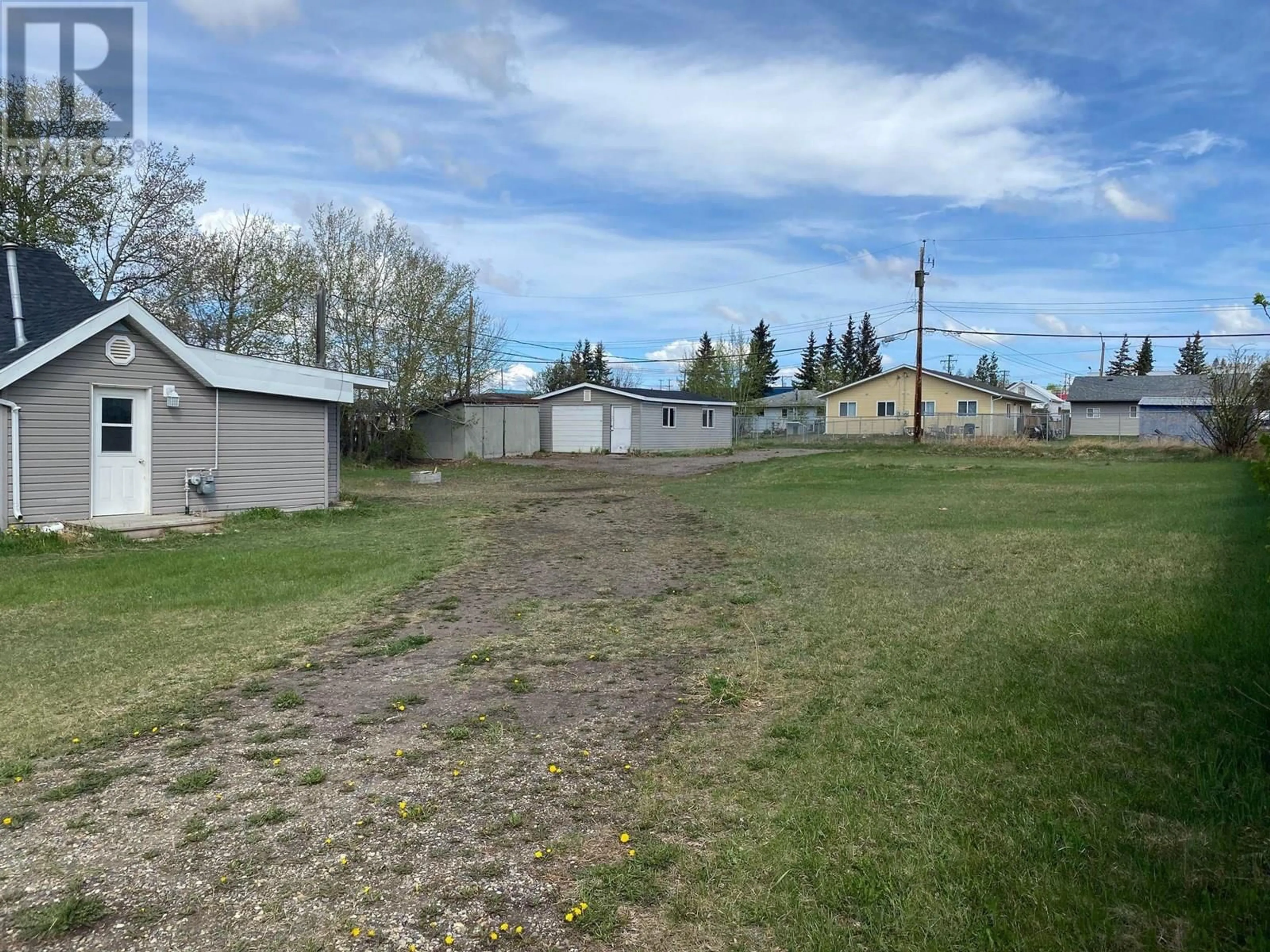 A pic from outside/outdoor area/front of a property/back of a property/a pic from drone, street for 1624 100 AVENUE, Dawson Creek British Columbia V1G1X2
