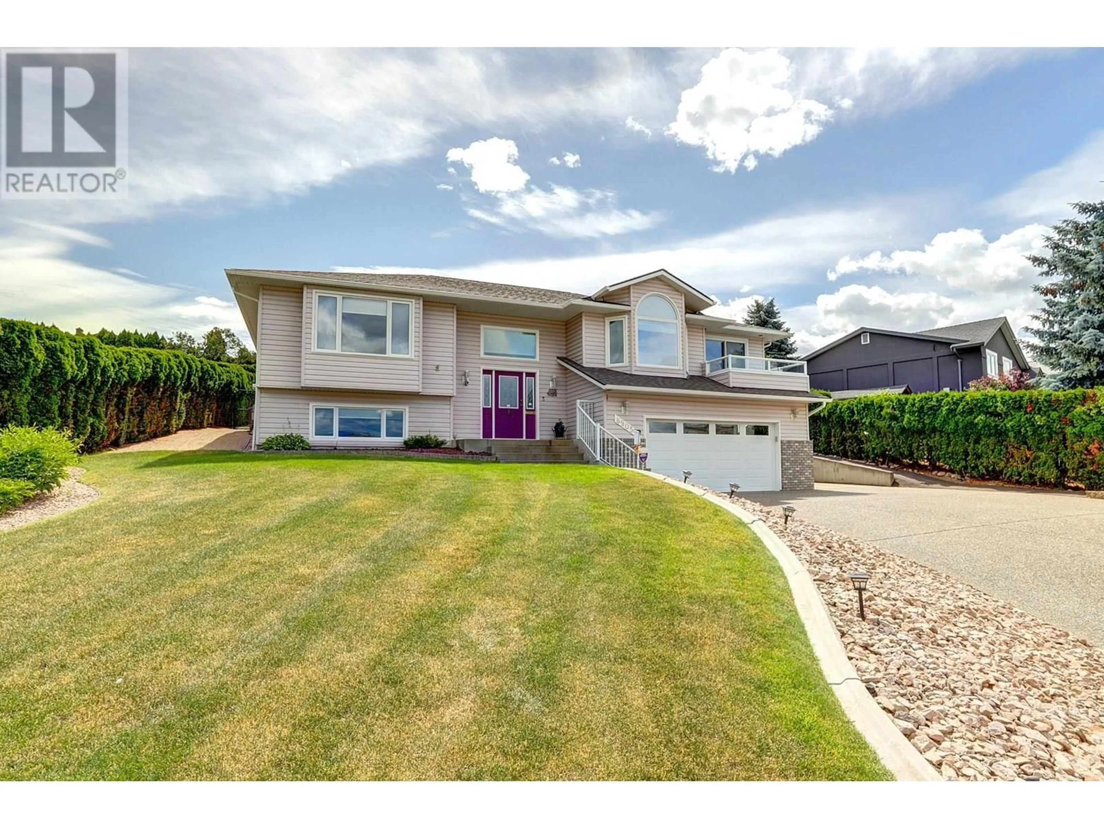 Home with vinyl exterior material, street for 8905 ORCHARD RIDGE DRIVE, Coldstream British Columbia V1B1Z7