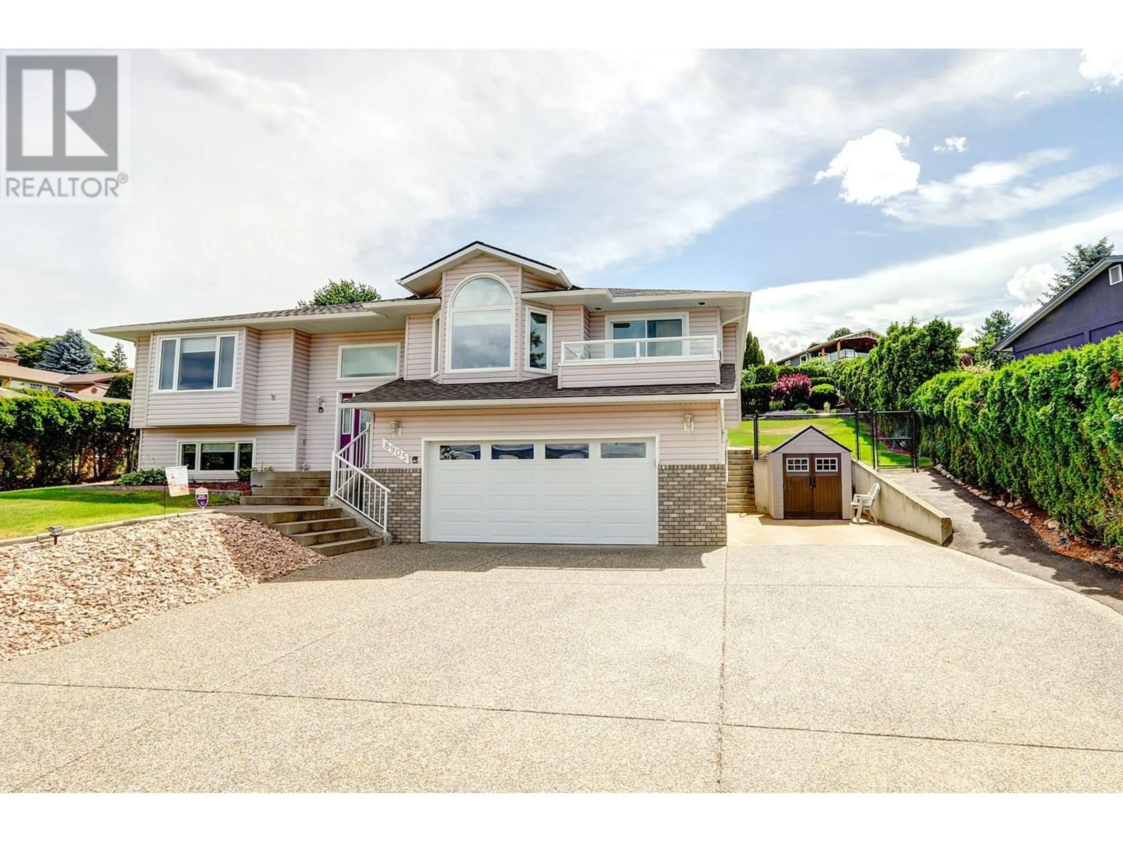 Home with vinyl exterior material, street for 8905 ORCHARD RIDGE DRIVE, Coldstream British Columbia V1B1Z7