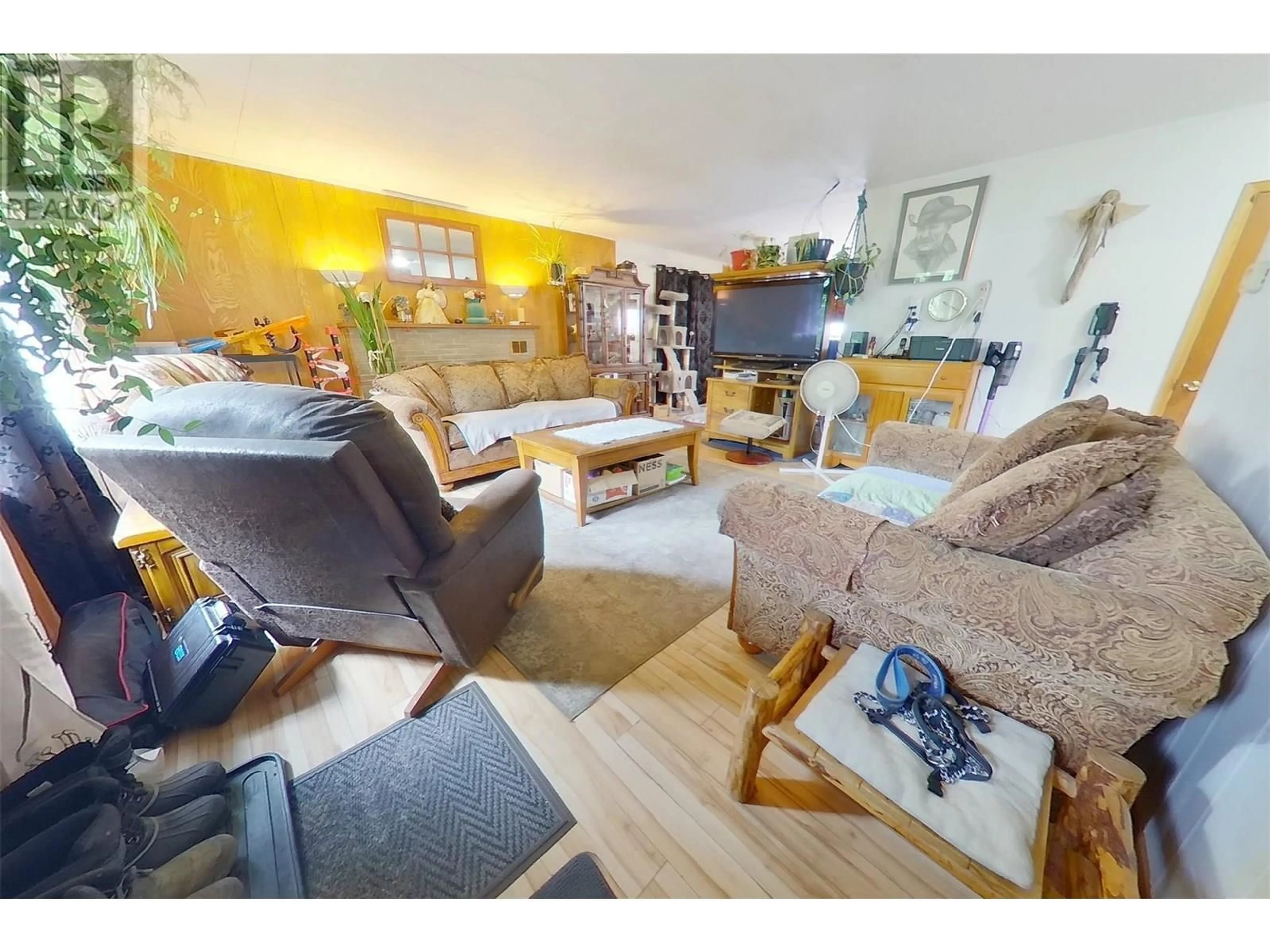 Living room with furniture, wood/laminate floor for 1916 ELM STREET, Creston British Columbia V0B1G5