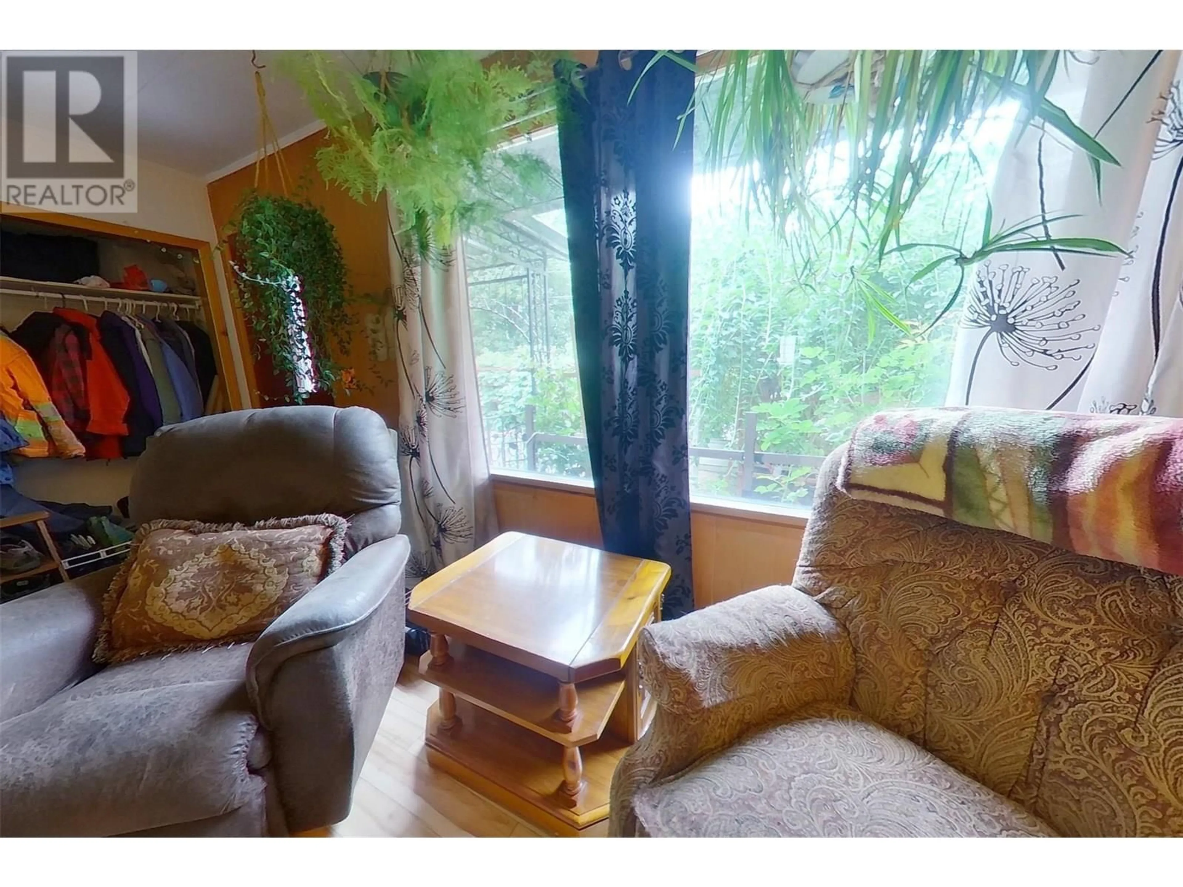 Living room with furniture, wood/laminate floor for 1916 ELM STREET, Creston British Columbia V0B1G5