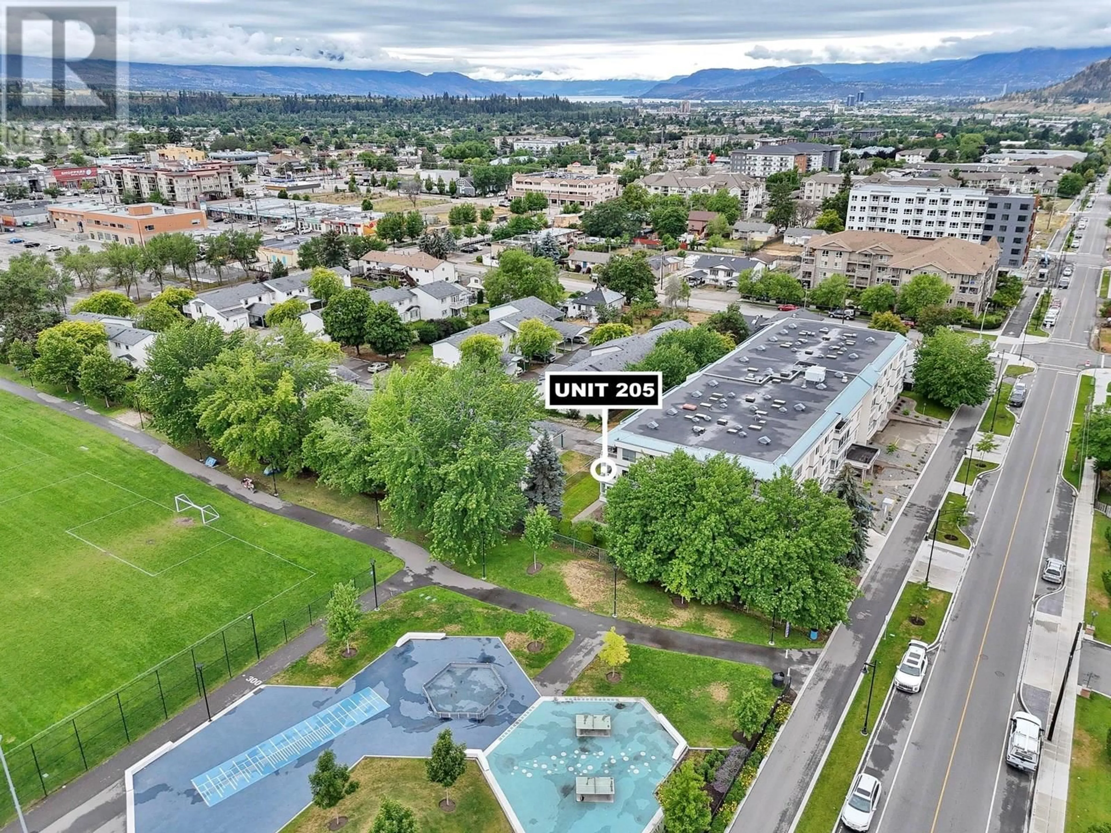 A pic from outside/outdoor area/front of a property/back of a property/a pic from drone, mountain view for 205 - 255 MCINTOSH ROAD, Kelowna British Columbia V1X2C5