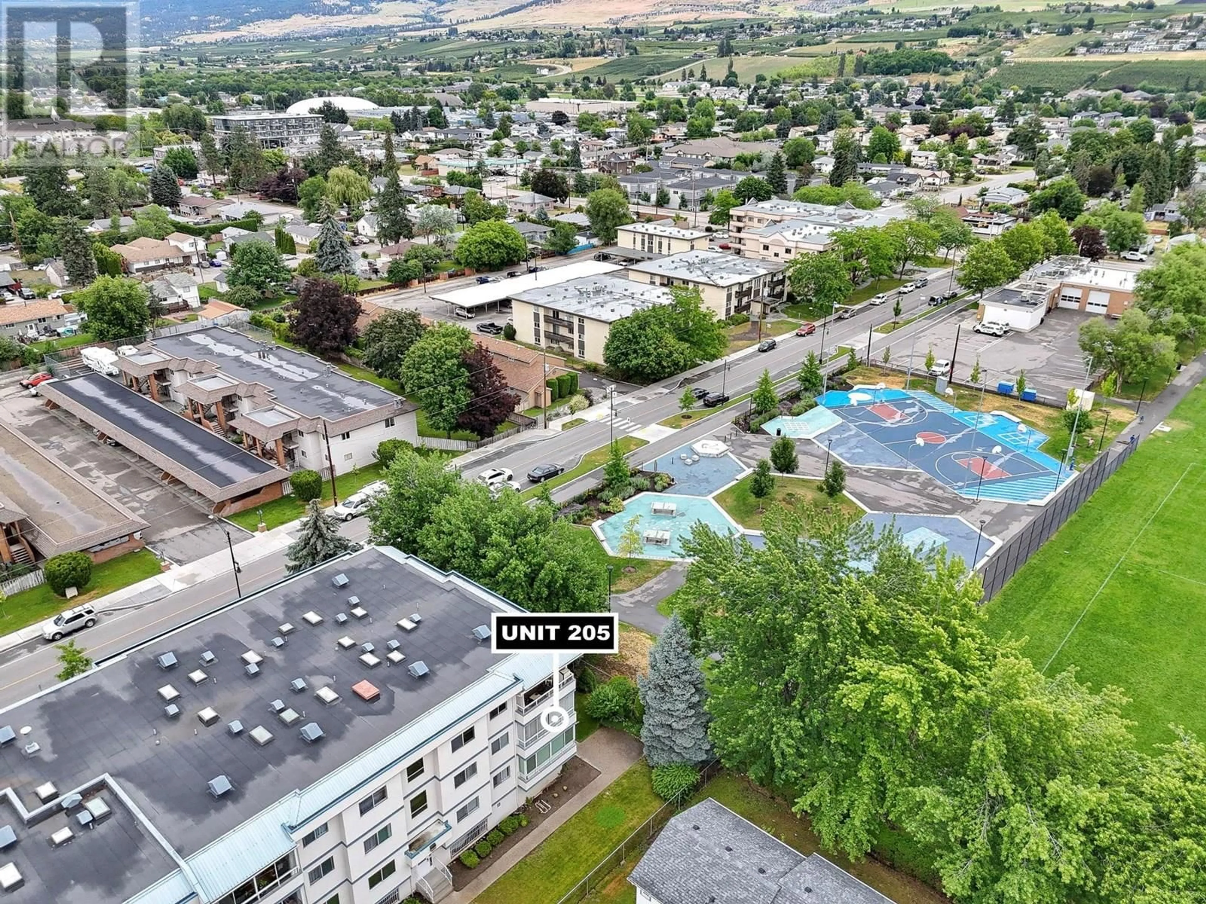 A pic from outside/outdoor area/front of a property/back of a property/a pic from drone, mountain view for 205 - 255 MCINTOSH ROAD, Kelowna British Columbia V1X2C5