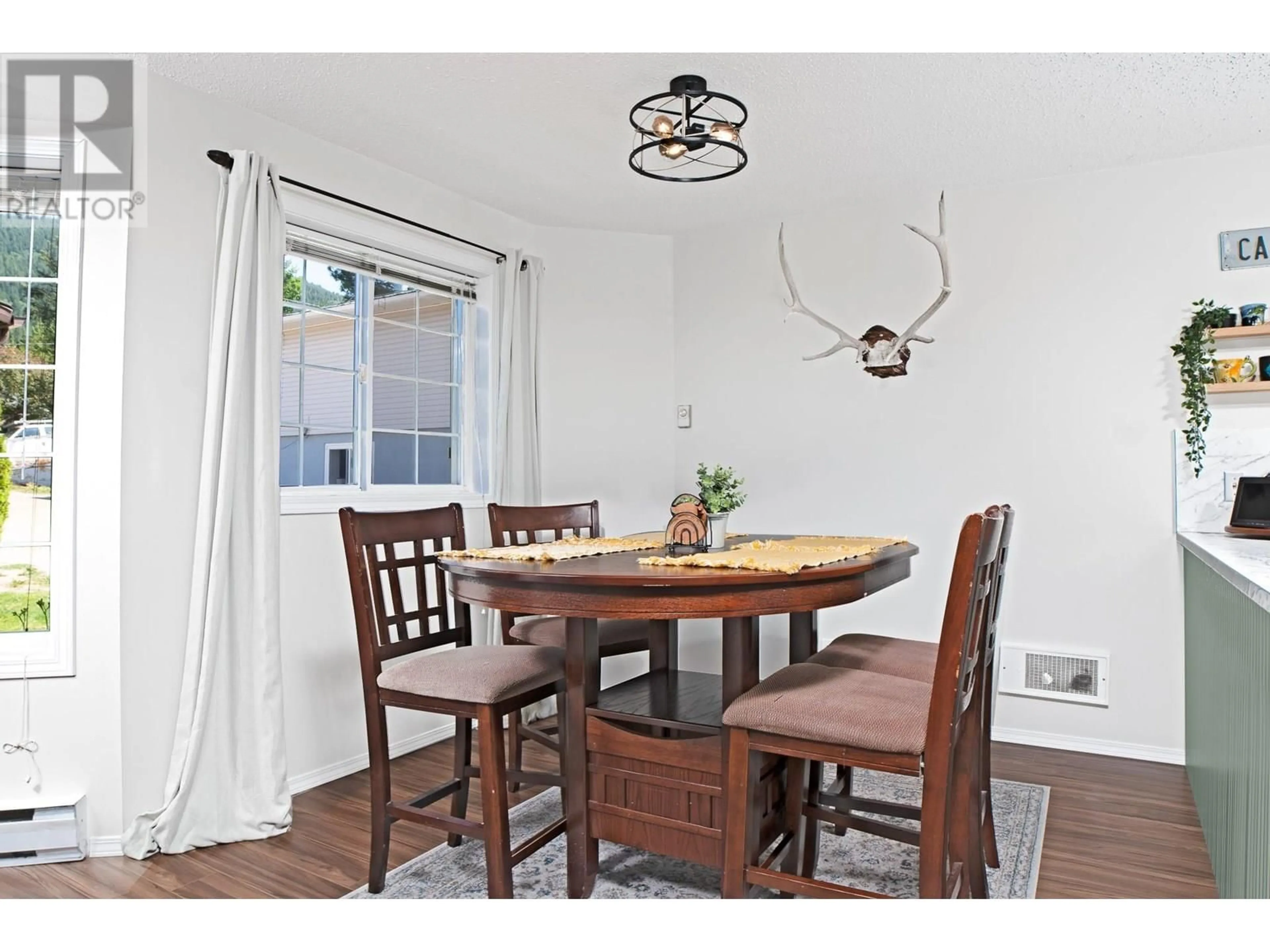 Dining room, wood/laminate floor for 5 - 1907 PINE STREET, Creston British Columbia V0B1G5