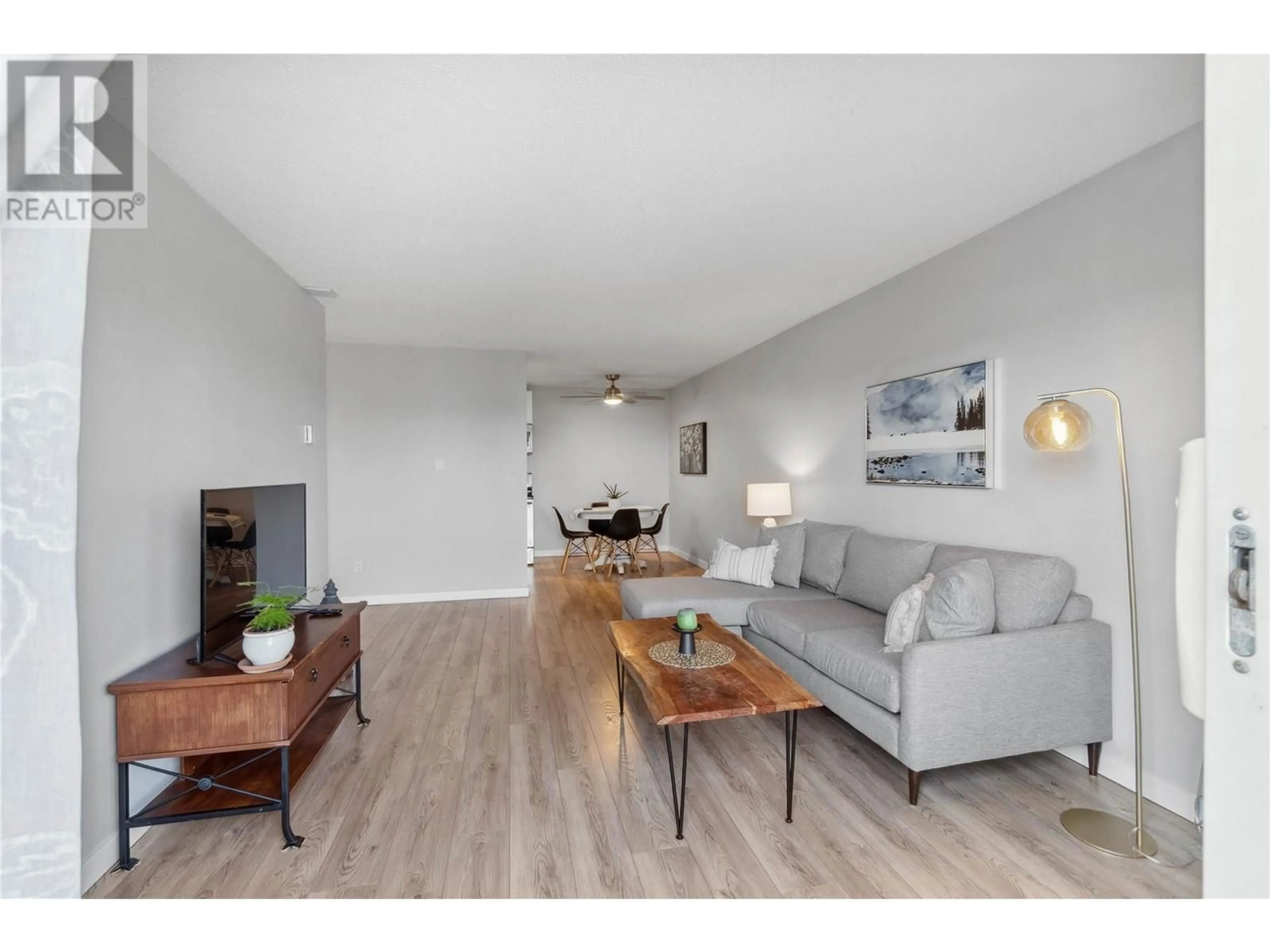 Living room with furniture, wood/laminate floor for 42 - 1810 SUMMIT DRIVE, Kamloops British Columbia V2E2C7