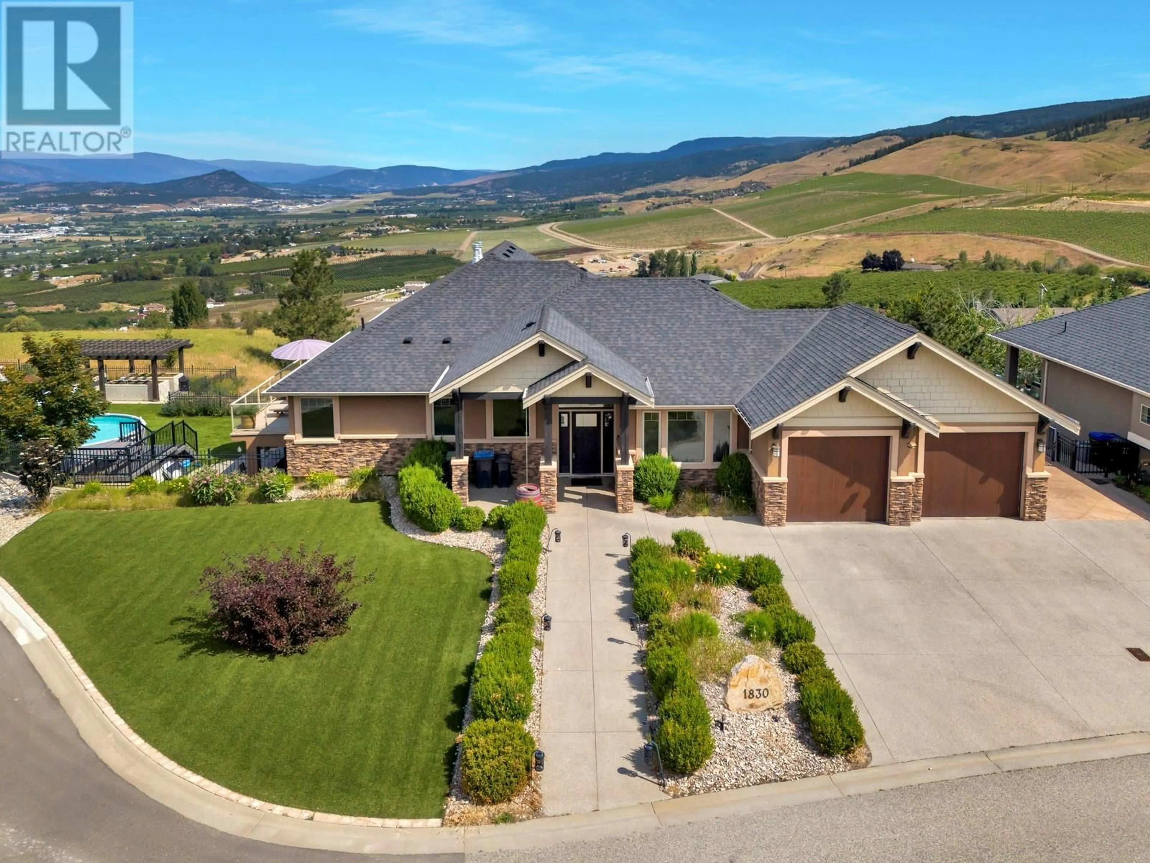 A pic from outside/outdoor area/front of a property/back of a property/a pic from drone, mountain view for 1830 BIRKDALE AVENUE, Kelowna British Columbia V1P1R7