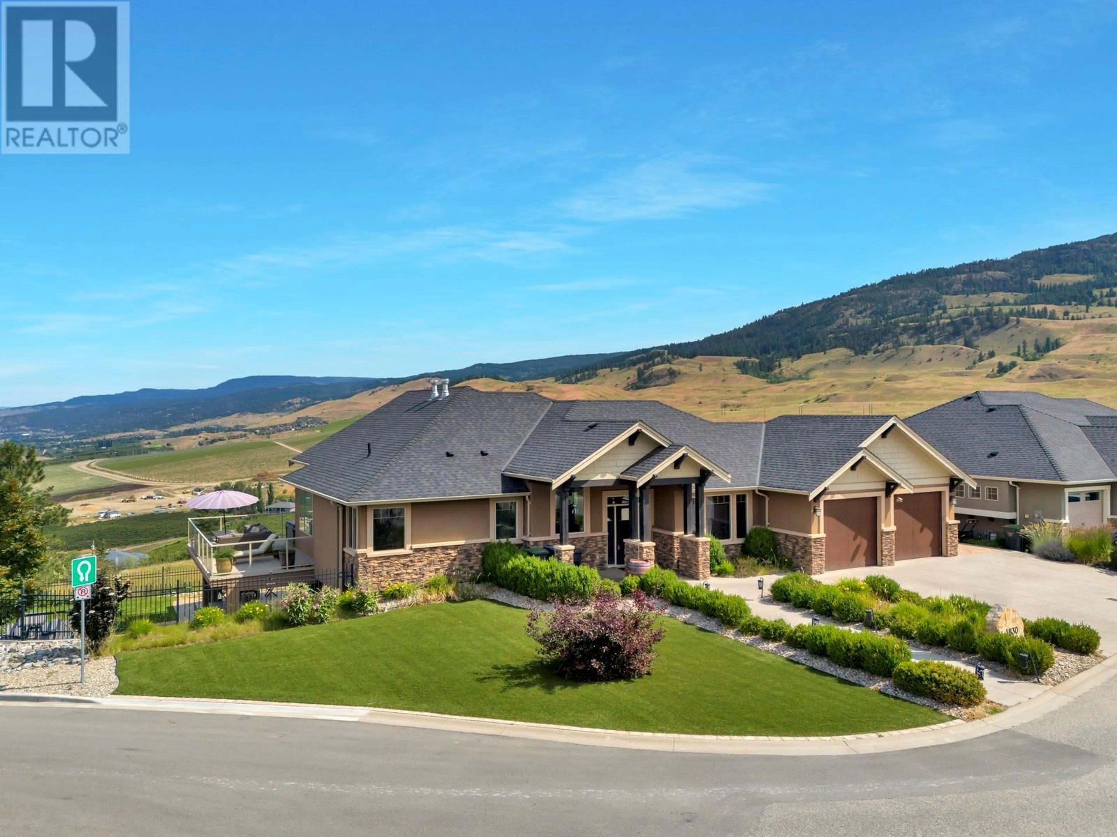 A pic from outside/outdoor area/front of a property/back of a property/a pic from drone, mountain view for 1830 BIRKDALE AVENUE, Kelowna British Columbia V1P1R7