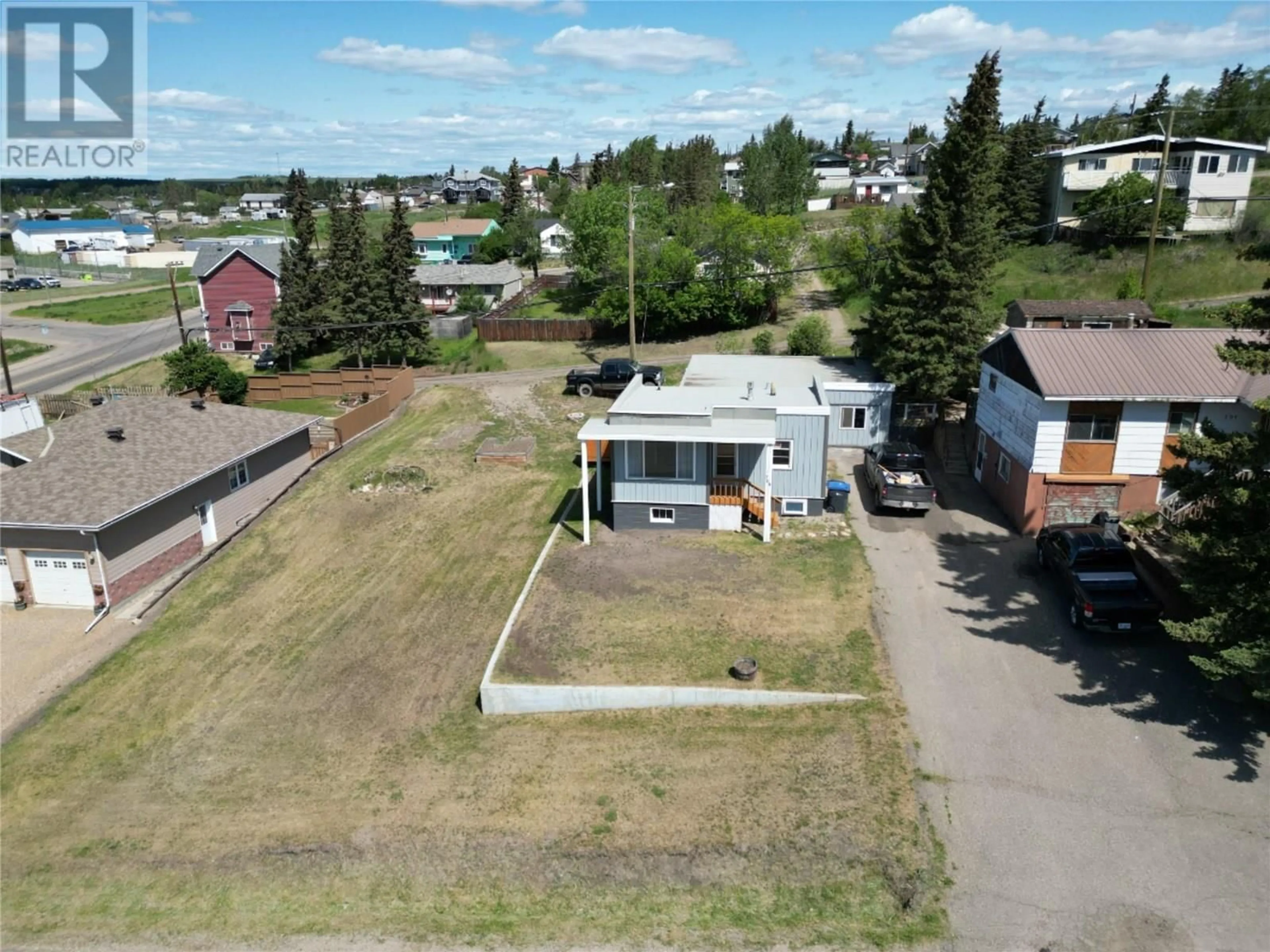 A pic from outside/outdoor area/front of a property/back of a property/a pic from drone, street for 708 100A AVENUE, Dawson Creek British Columbia V1G1X9