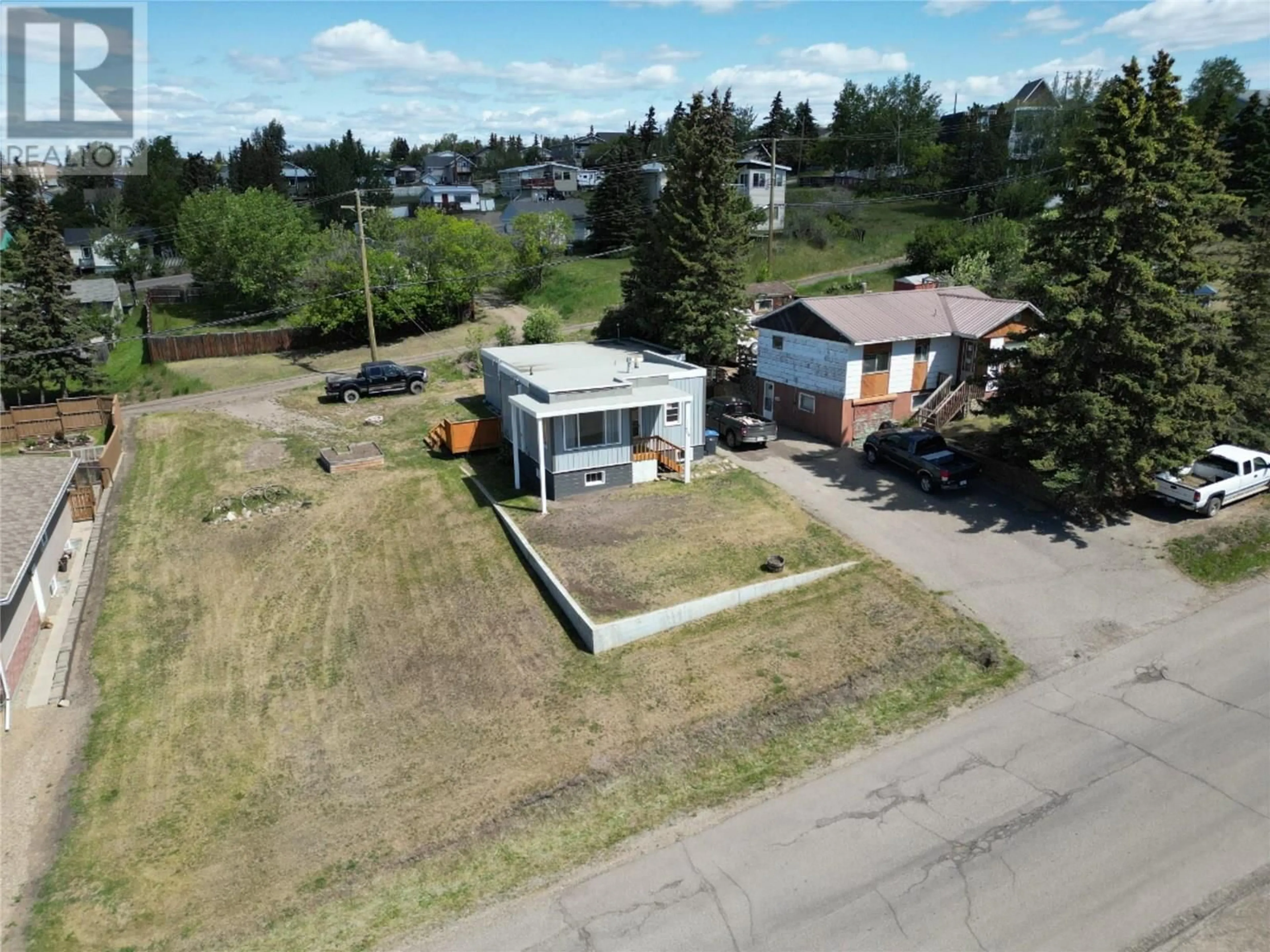 A pic from outside/outdoor area/front of a property/back of a property/a pic from drone, street for 708 100A AVENUE, Dawson Creek British Columbia V1G1X9