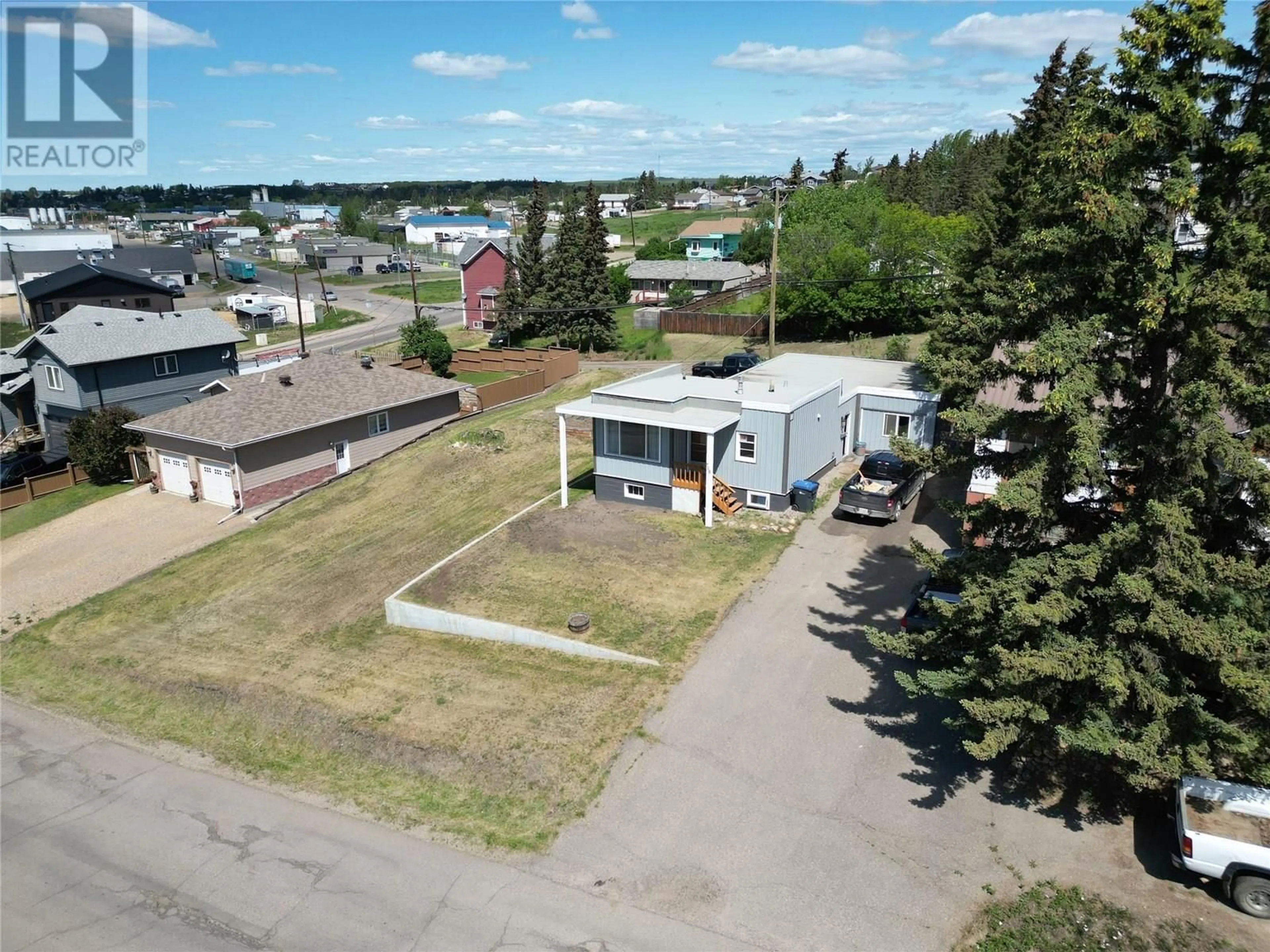 A pic from outside/outdoor area/front of a property/back of a property/a pic from drone, unknown for 708 100A AVENUE, Dawson Creek British Columbia V1G1X9