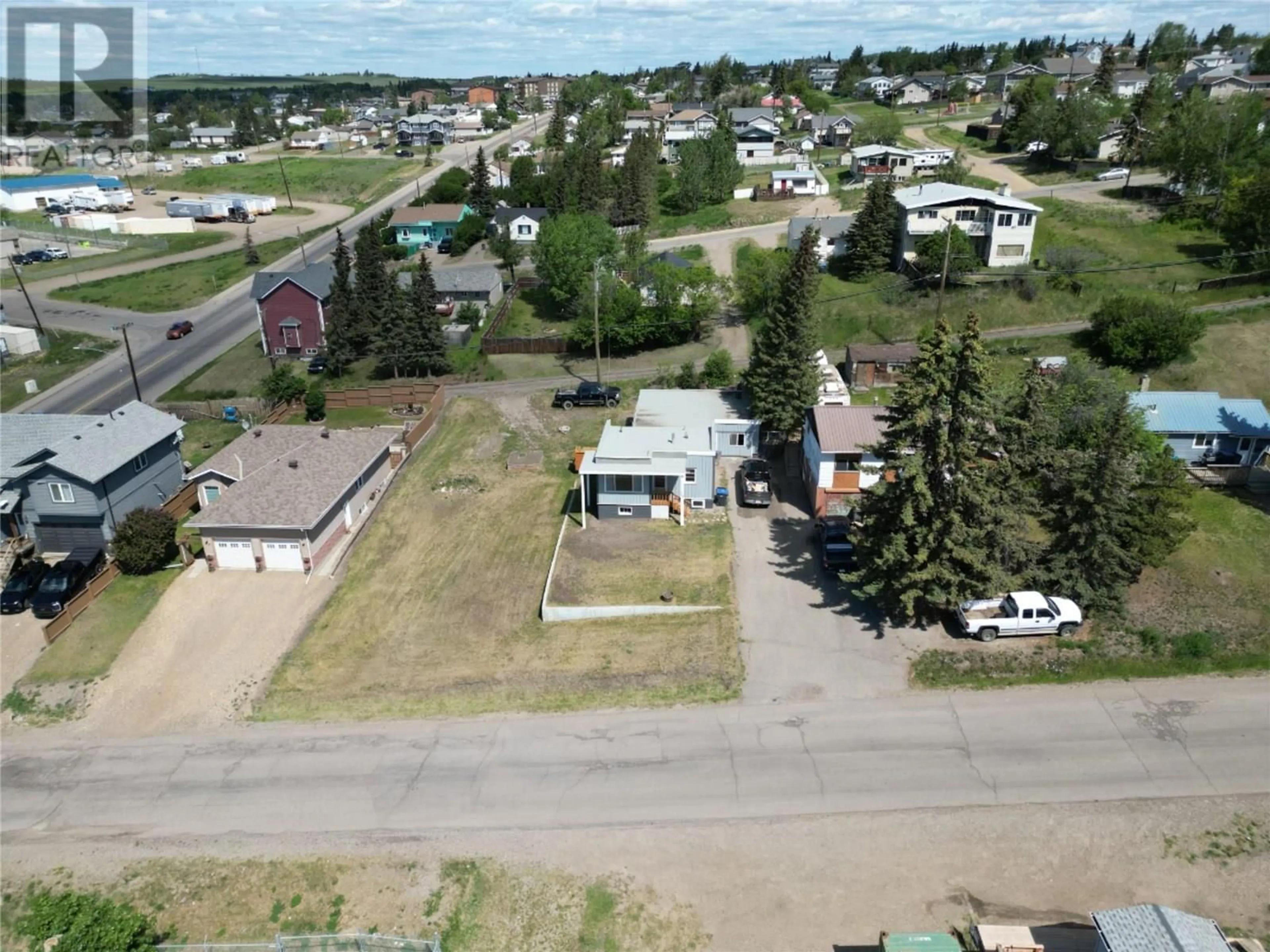A pic from outside/outdoor area/front of a property/back of a property/a pic from drone, street for 708 100A AVENUE, Dawson Creek British Columbia V1G1X9