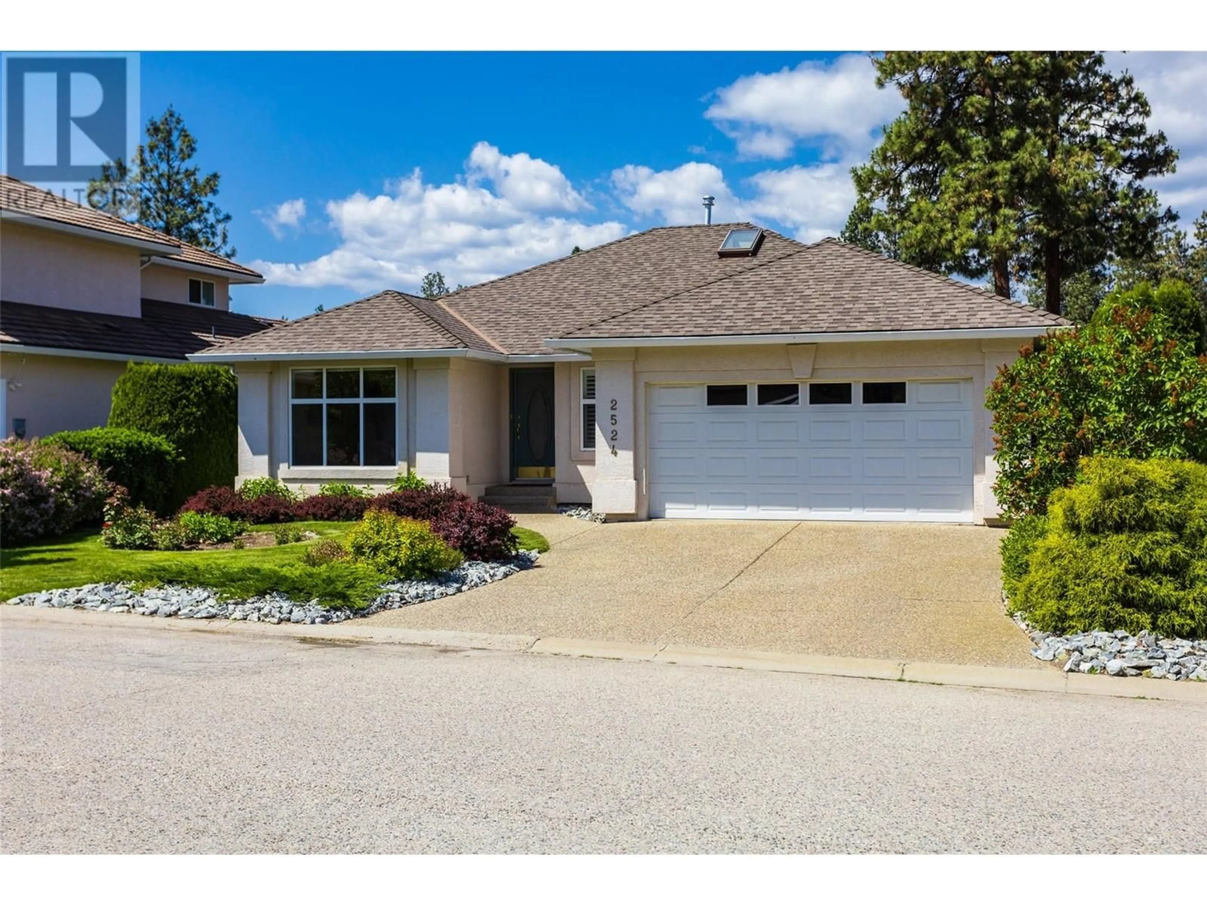 Home with vinyl exterior material, street for 2524 QUAIL LANE, Kelowna British Columbia V1V1Z9
