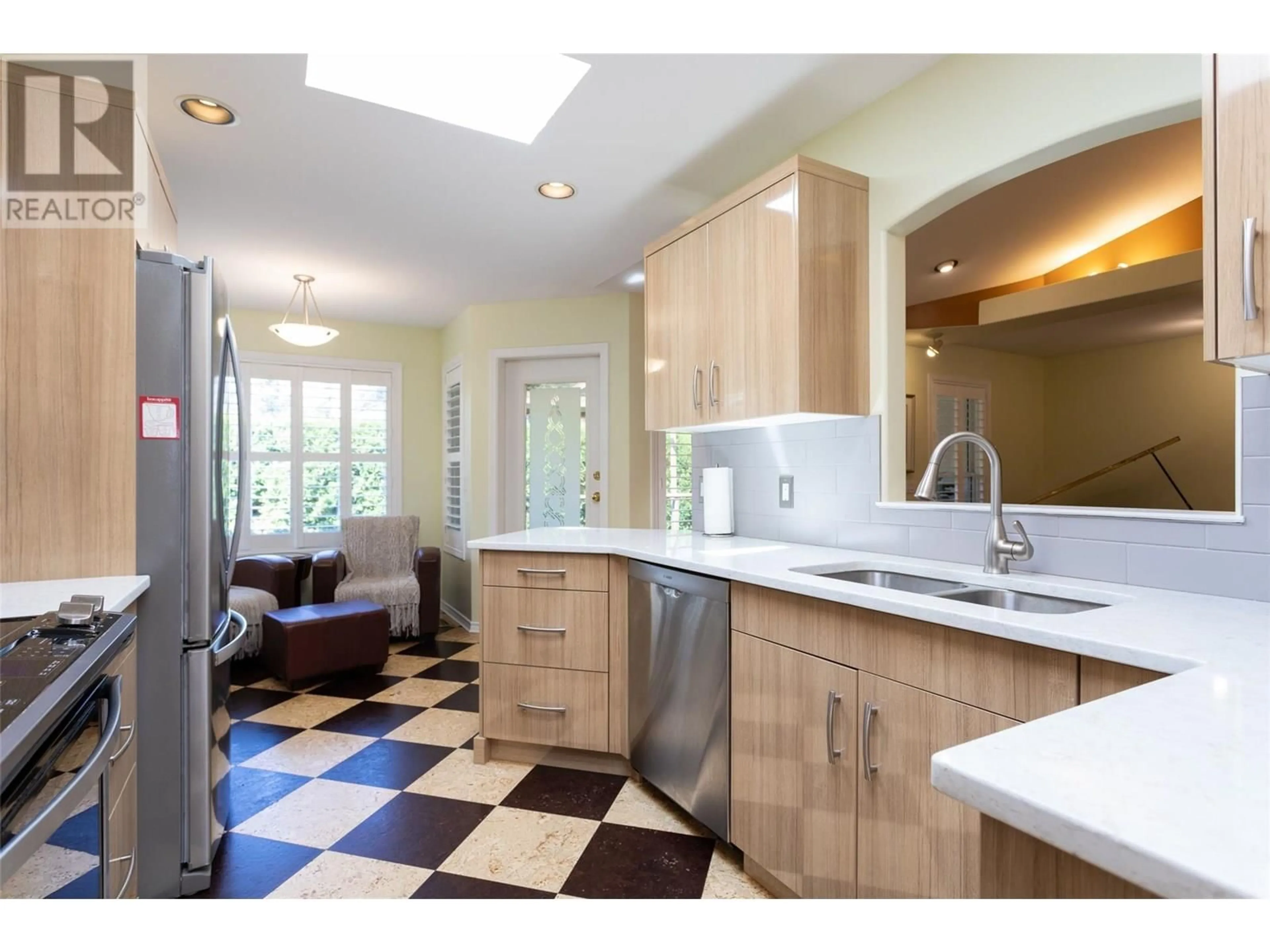 Open concept kitchen, ceramic/tile floor for 2524 QUAIL LANE, Kelowna British Columbia V1V1Z9