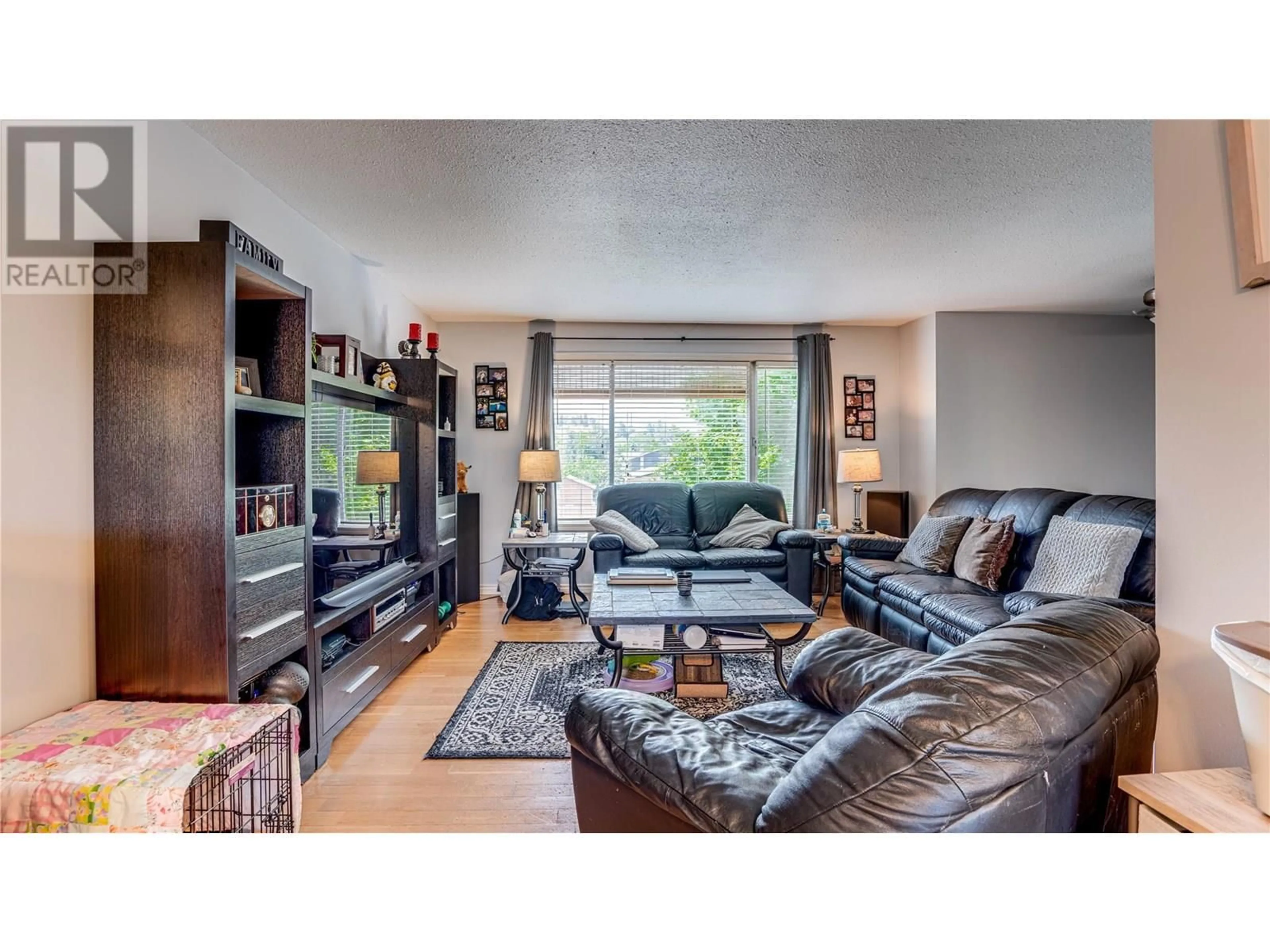 Living room with furniture, wood/laminate floor for 1777 BIGHORN ROAD, Vernon British Columbia V1T8X4
