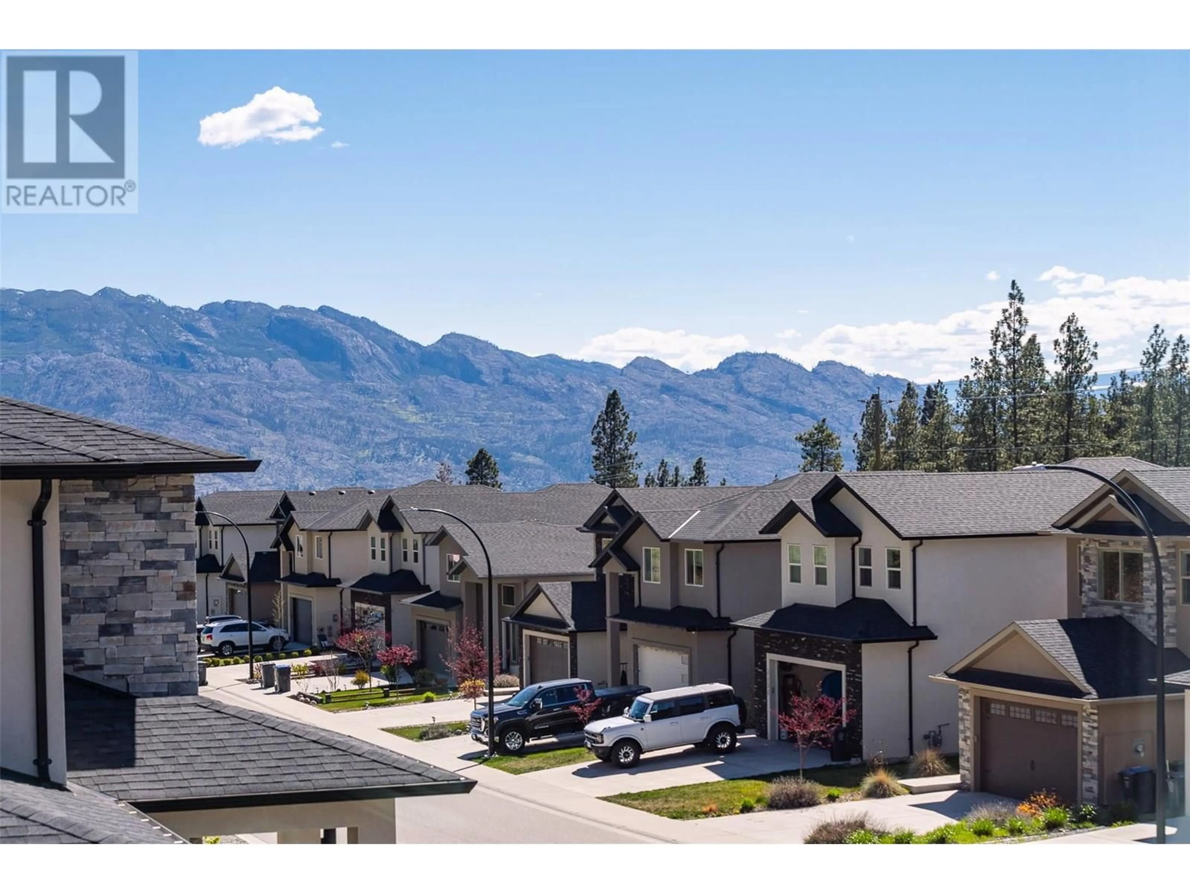 A pic from outside/outdoor area/front of a property/back of a property/a pic from drone, mountain view for 3119 RIESLING WAY, West Kelowna British Columbia V4T3M7