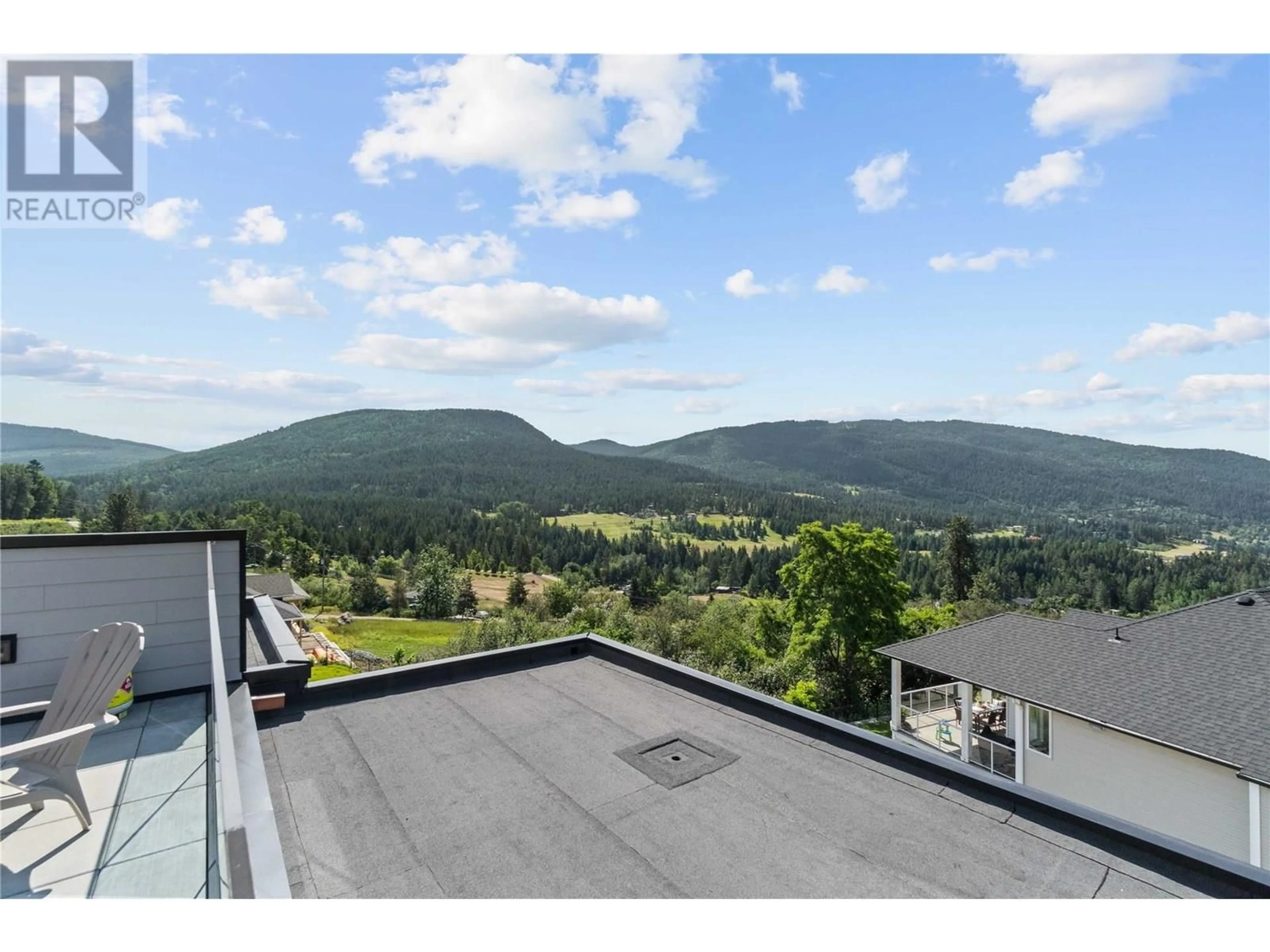 A pic from outside/outdoor area/front of a property/back of a property/a pic from drone, mountain view for 140 WHITEFISH ROAD, Vernon British Columbia V1B3M5