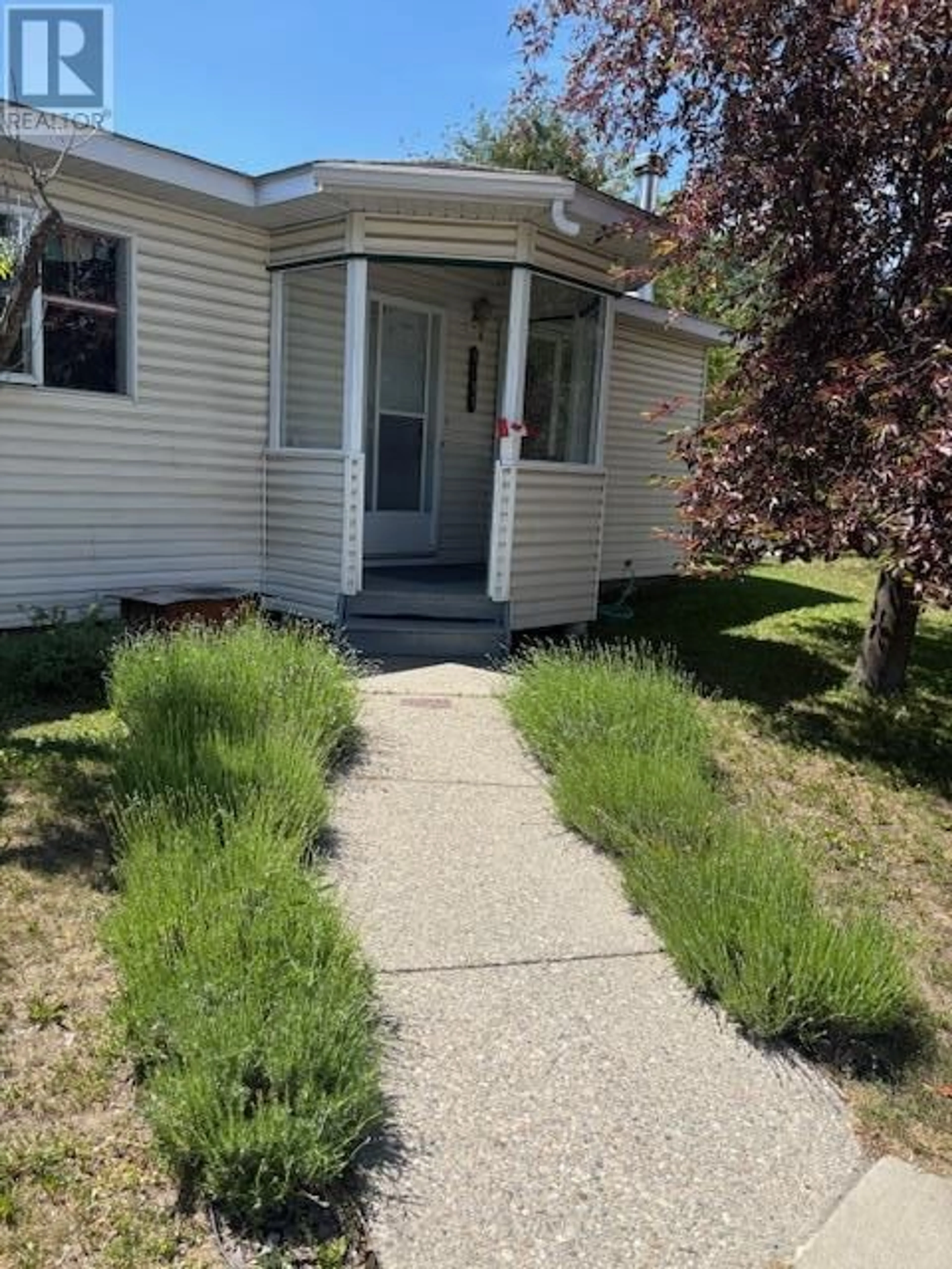 Home with vinyl exterior material, street for 1291 4TH AVENUE, Fernie British Columbia V0B1M0
