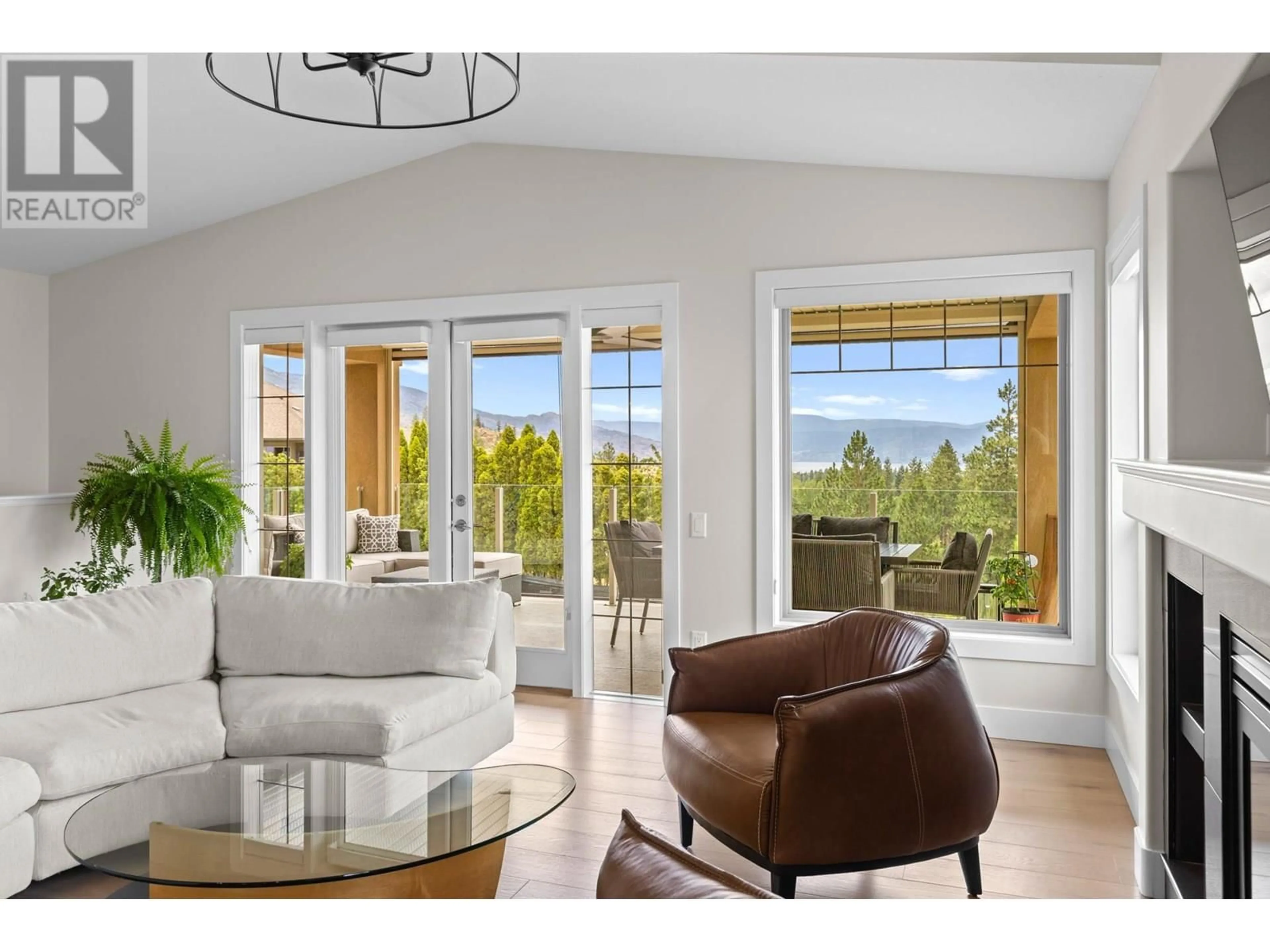 Living room with furniture, wood/laminate floor for 5157 SOUTH RIDGE DRIVE, Kelowna British Columbia V1W4Z4