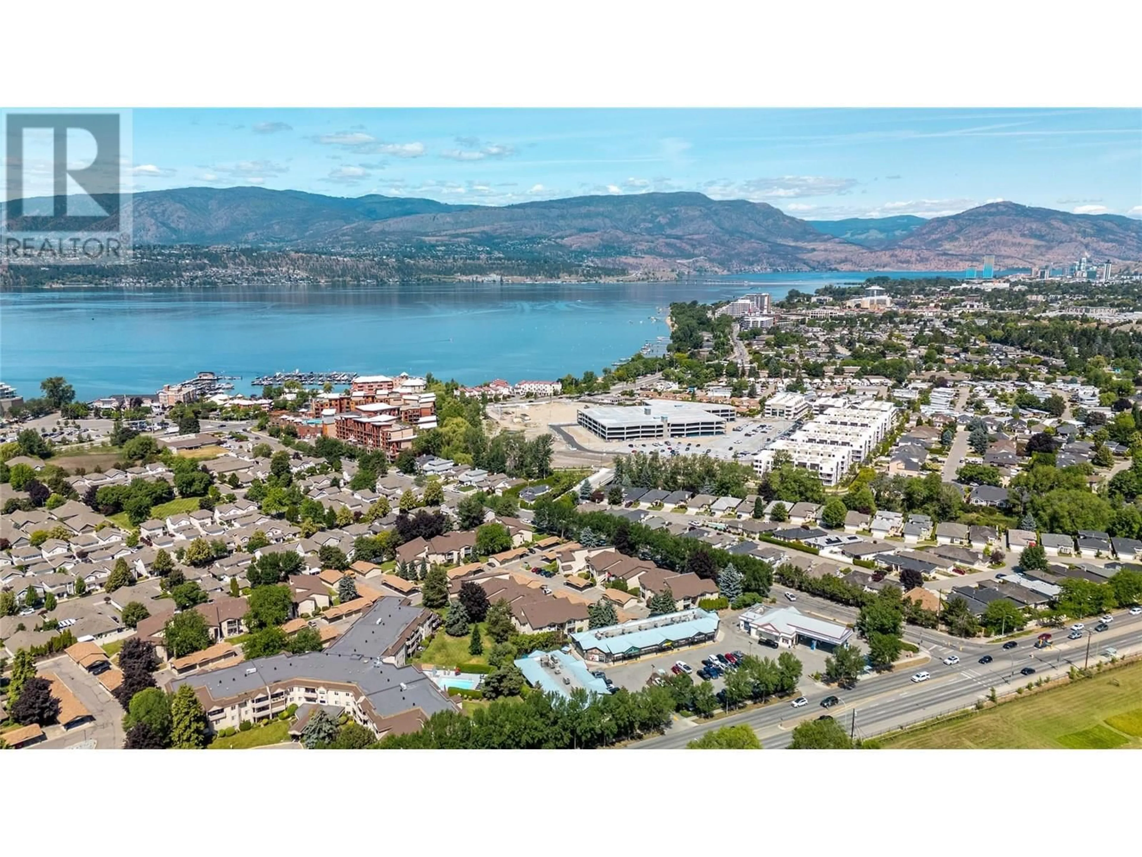 A pic from outside/outdoor area/front of a property/back of a property/a pic from drone, water/lake/river/ocean view for 207C - 735 COOK ROAD, Kelowna British Columbia V1W3G6