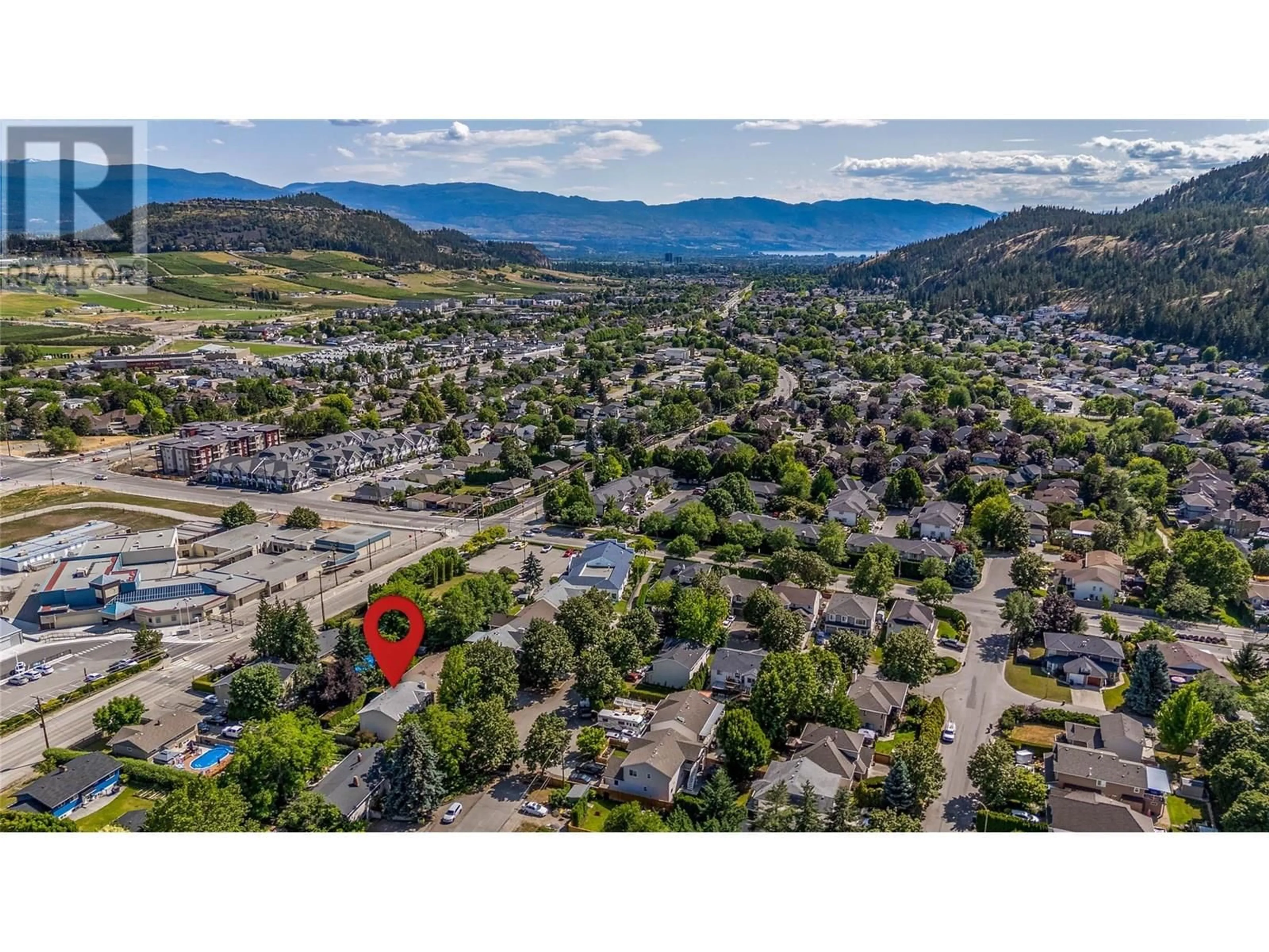 A pic from outside/outdoor area/front of a property/back of a property/a pic from drone, mountain view for 1887 MILLARD COURT EAST, Kelowna British Columbia V1V1R2