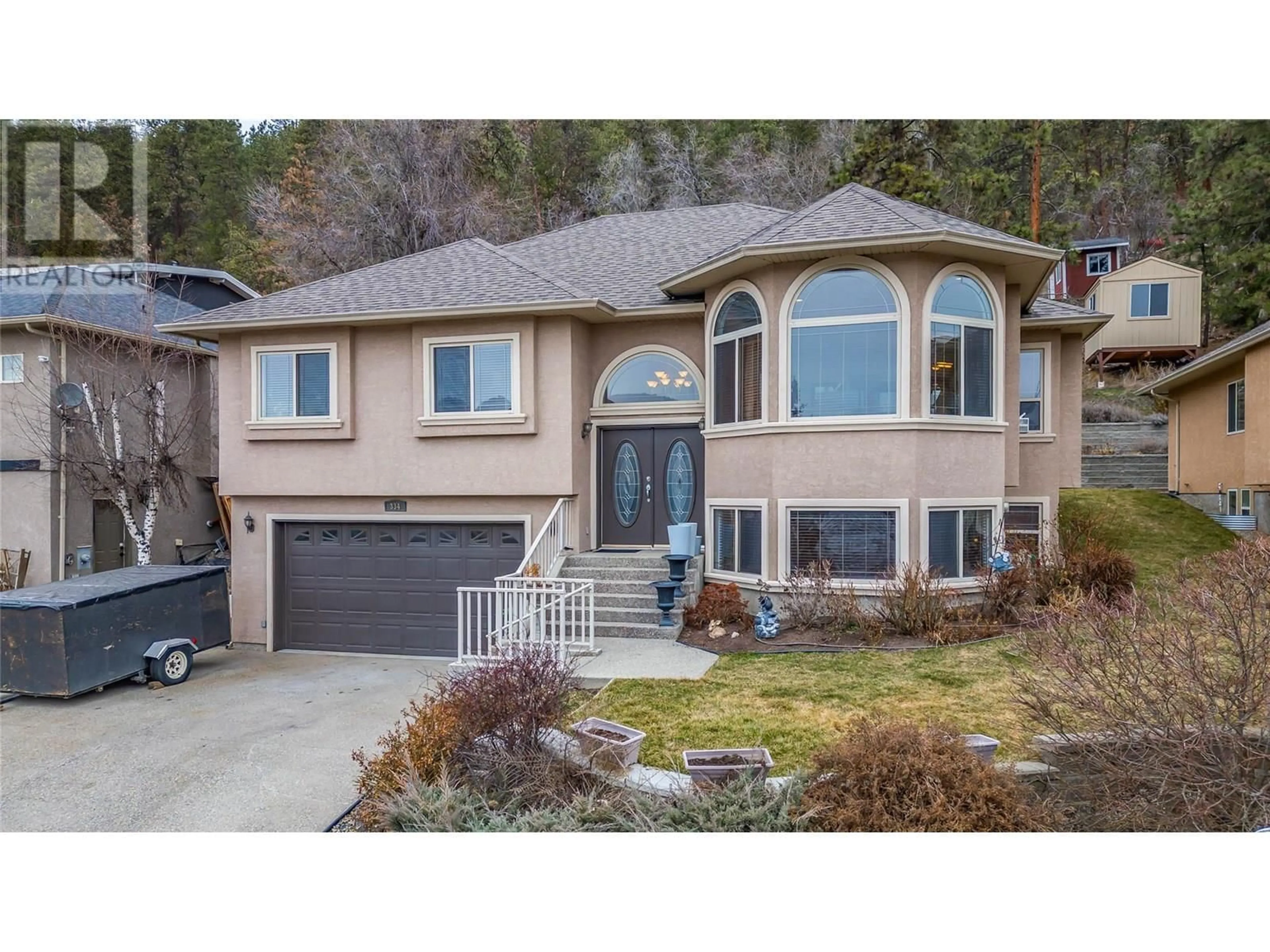 Home with vinyl exterior material, street for 334 MOUBRAY ROAD, Kelowna British Columbia V1V1R5