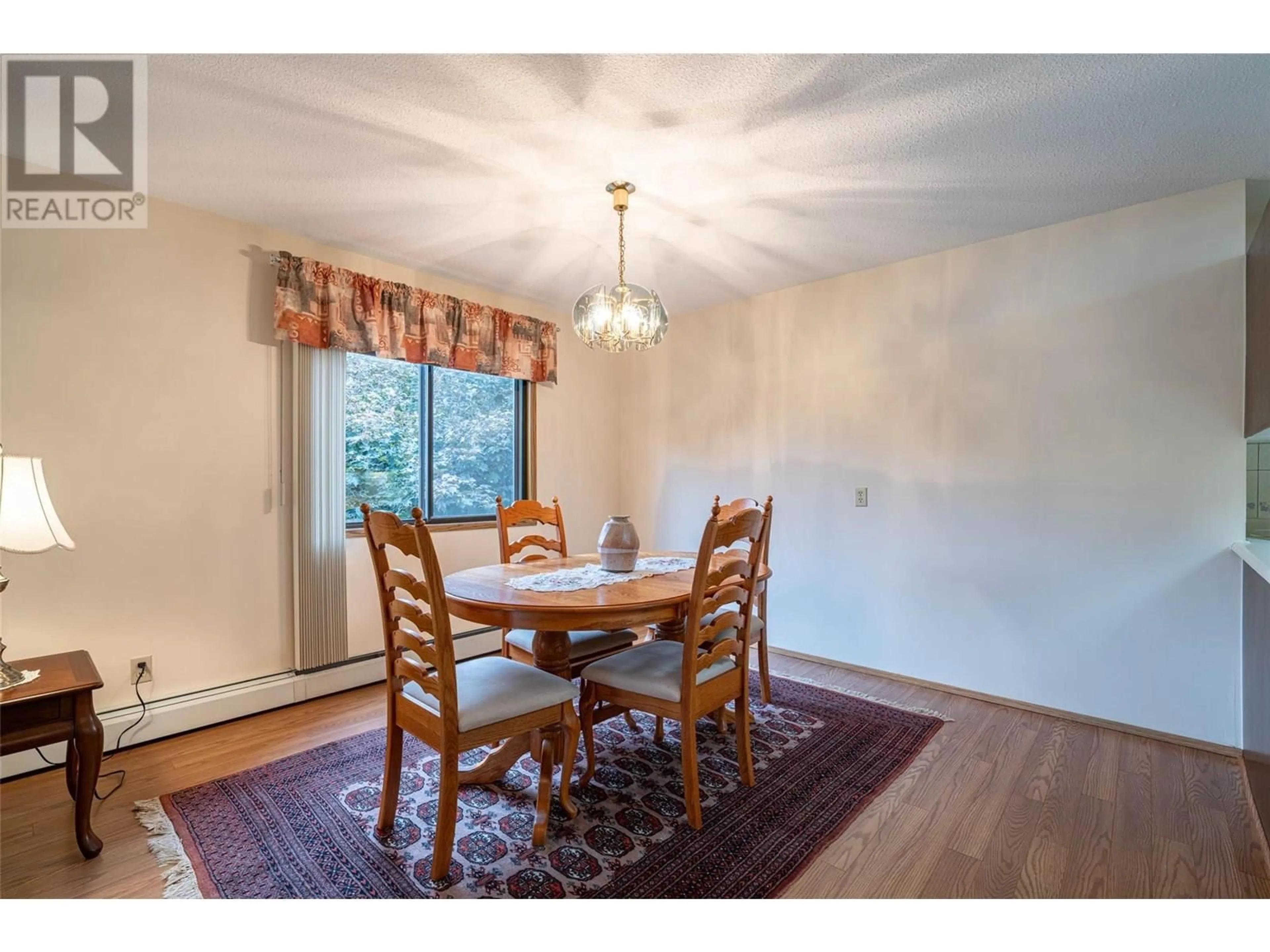 Dining room, wood/laminate floor for 212 - 3608 27 AVENUE, Vernon British Columbia V1T1S4