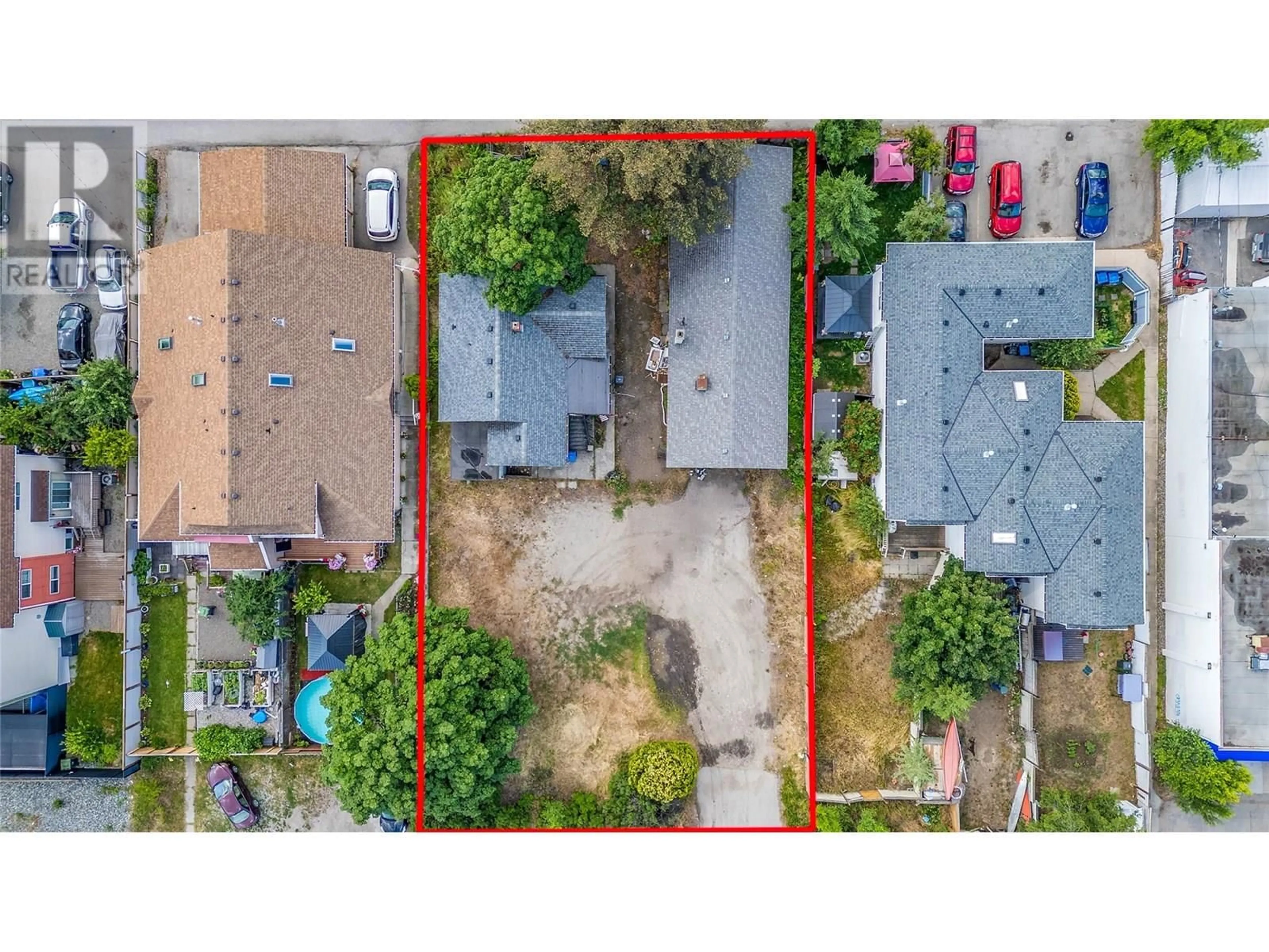 A pic from outside/outdoor area/front of a property/back of a property/a pic from drone, street for 307 33 HIGHWAY EAST, Kelowna British Columbia V1X2A4