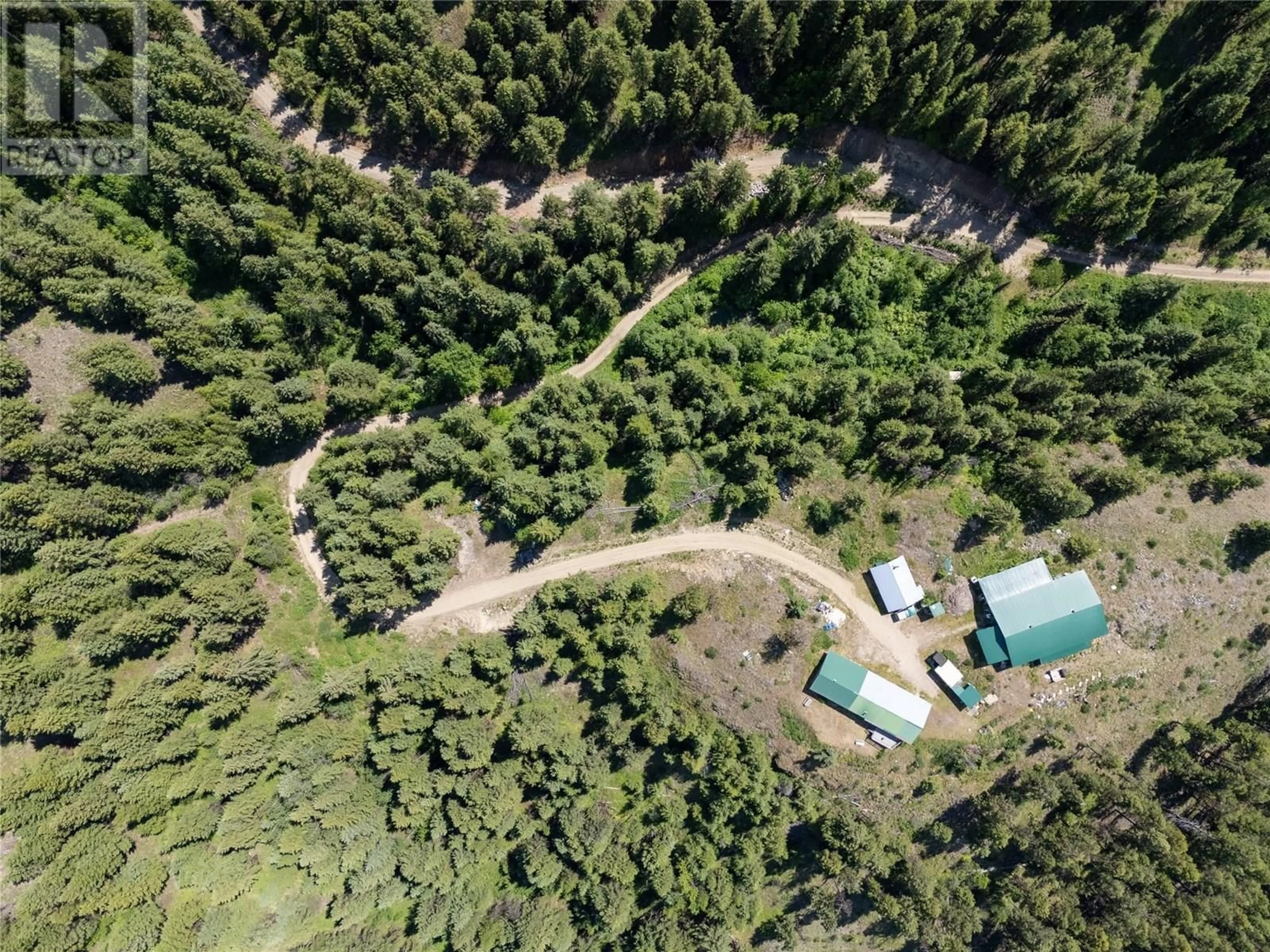 A pic from outside/outdoor area/front of a property/back of a property/a pic from drone, forest/trees view for 335 SOLOMON ROAD, Beaverdell British Columbia V0H1A0